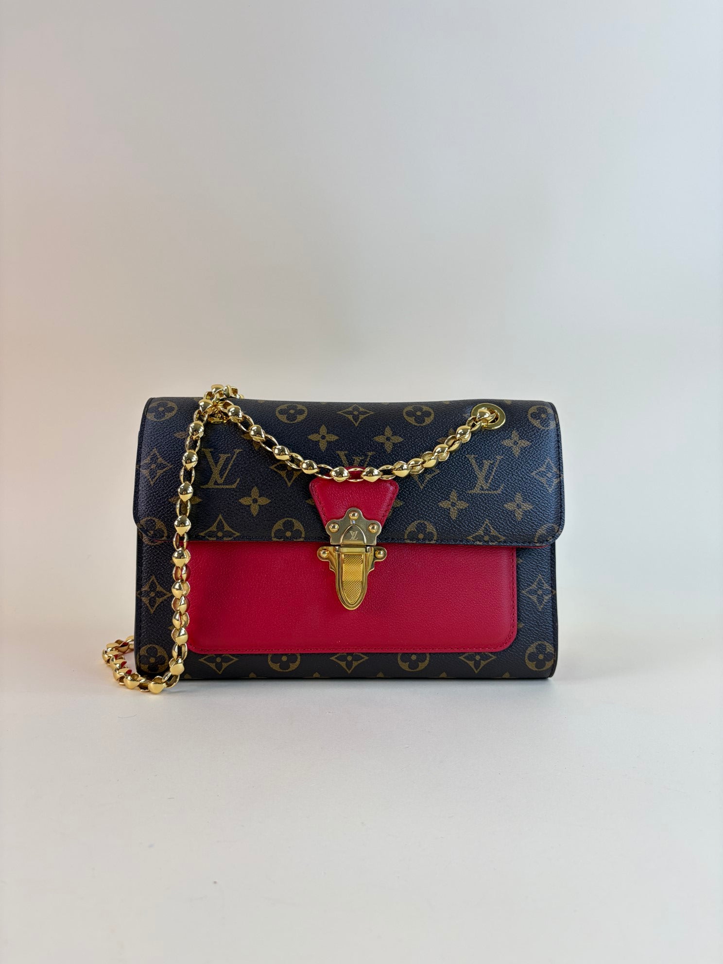 Louis Vuitton Monogram red flap Victoire Bag