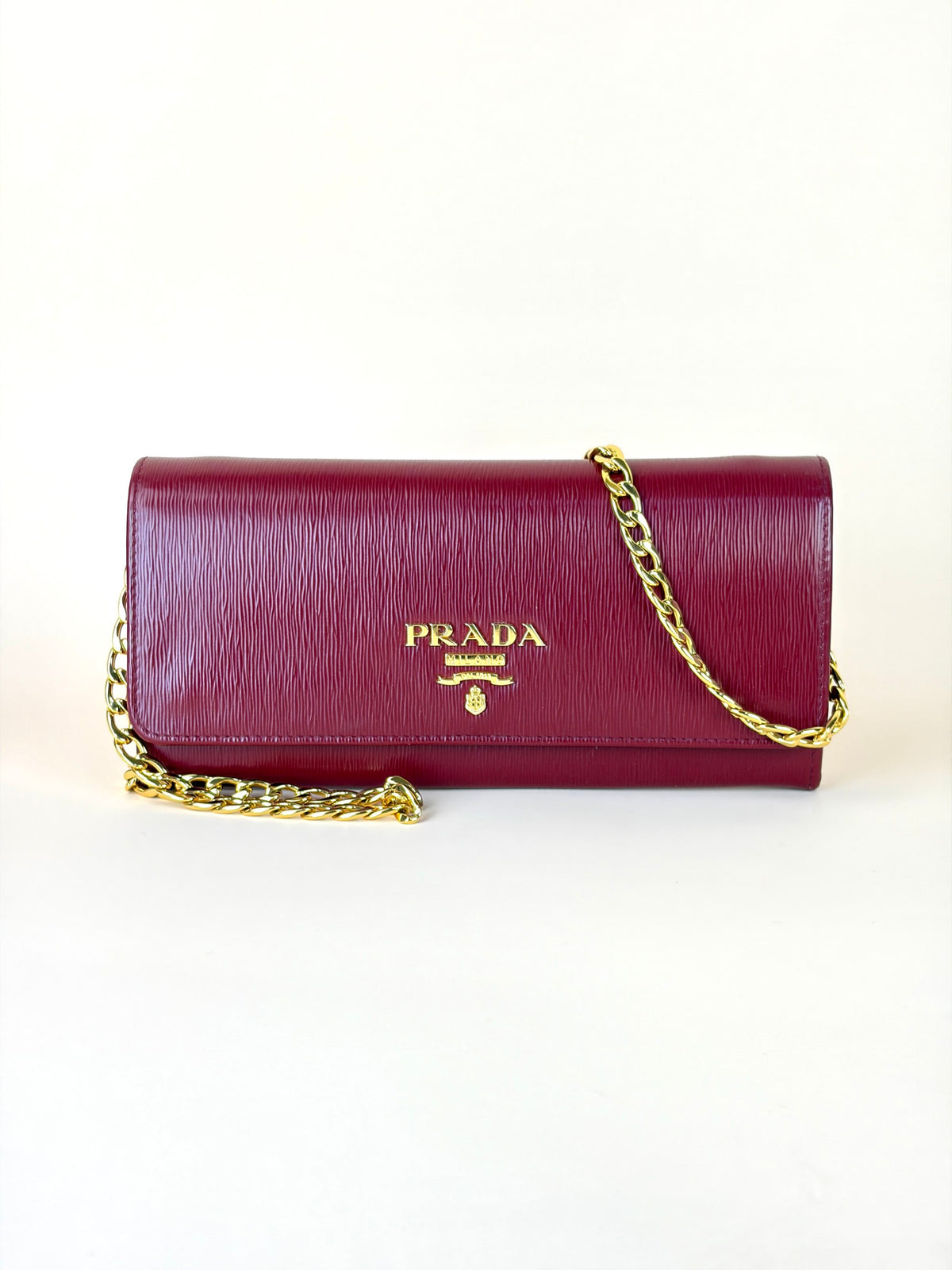 Prada rubino vitello move leather wallet on chain clutch