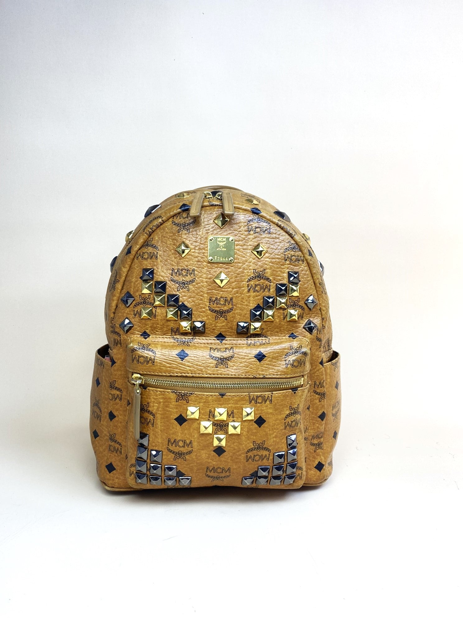 brown leather studded backpack MCM cognac small backpack brown with studded