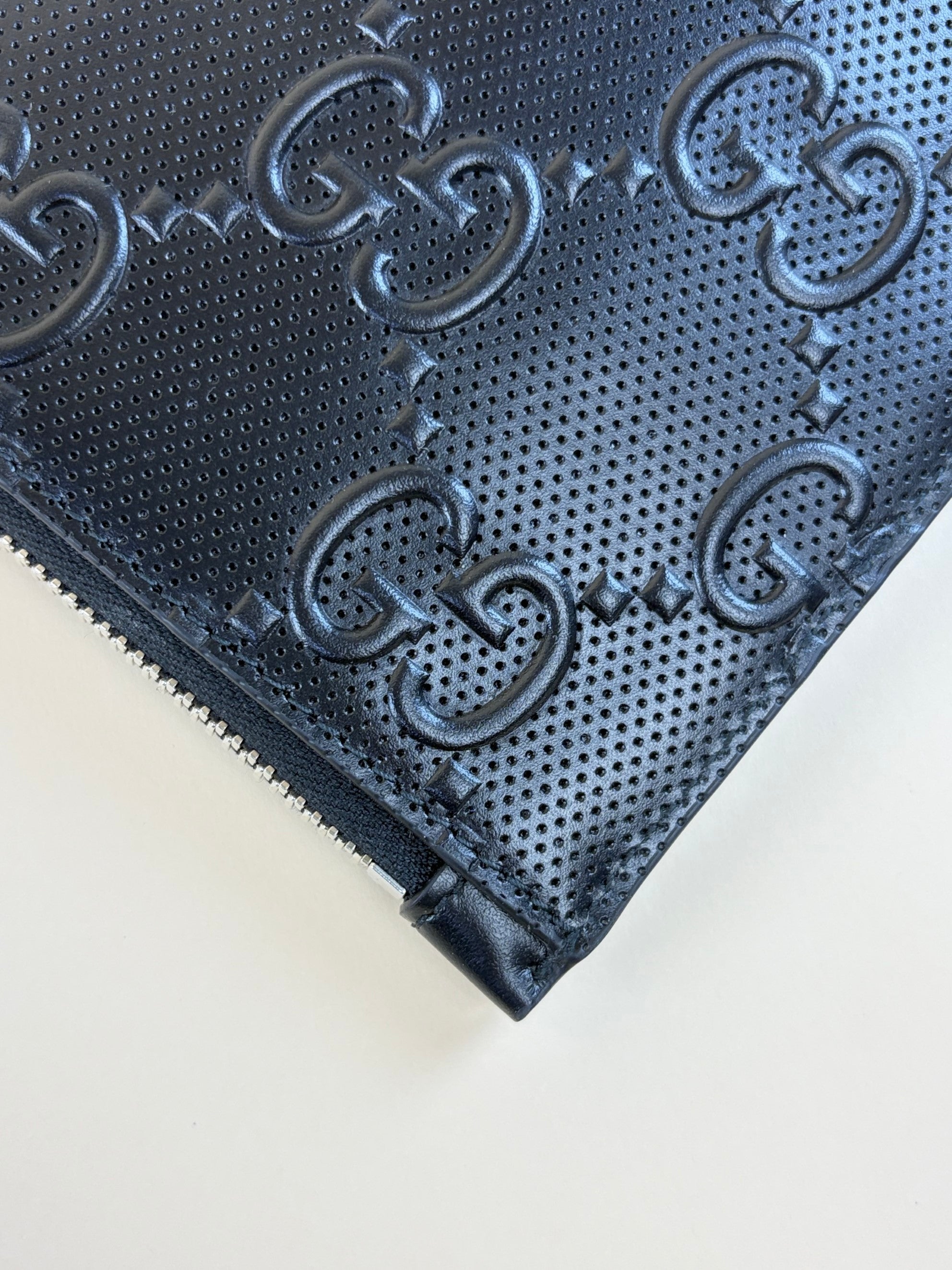 Gucci Black GG Tennis Embossed Wristlet Pouch