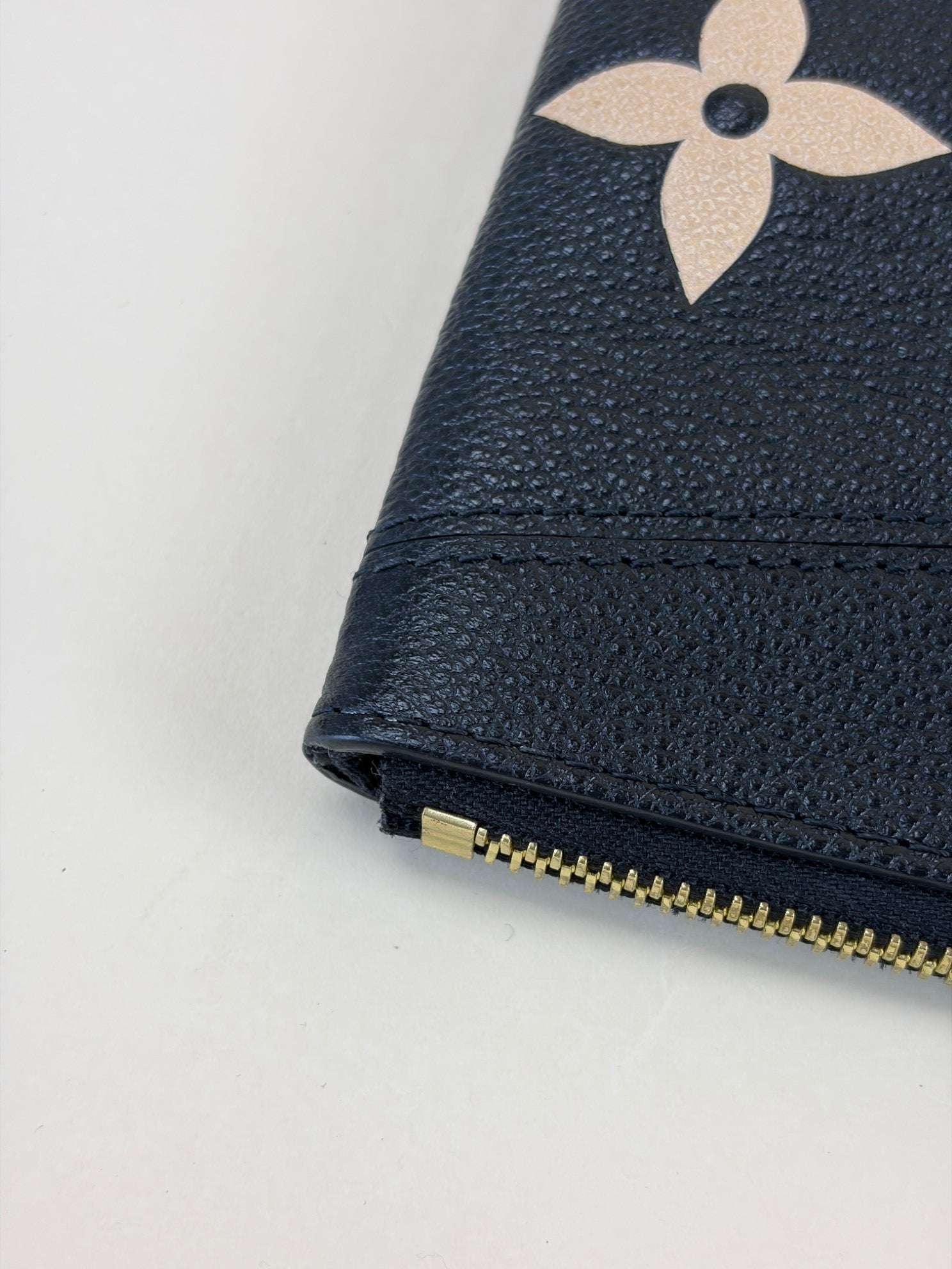 Louis Vuitton black and beige empreinte monogram giant daily pouch