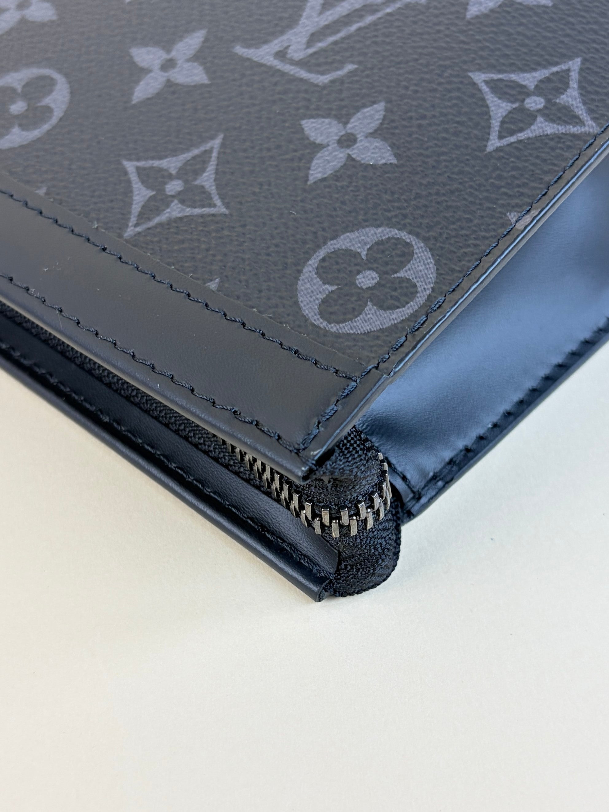 louis Vuitton monogram eclipse voyage mm pochette