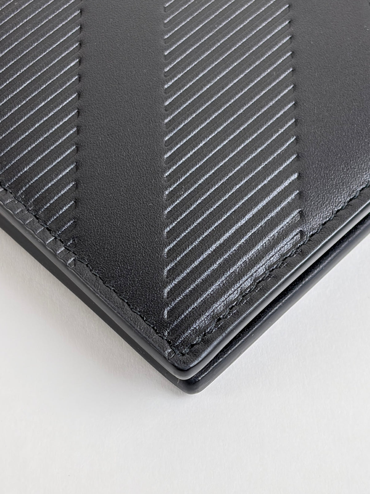 Burberry embossed check slim bifold wallet