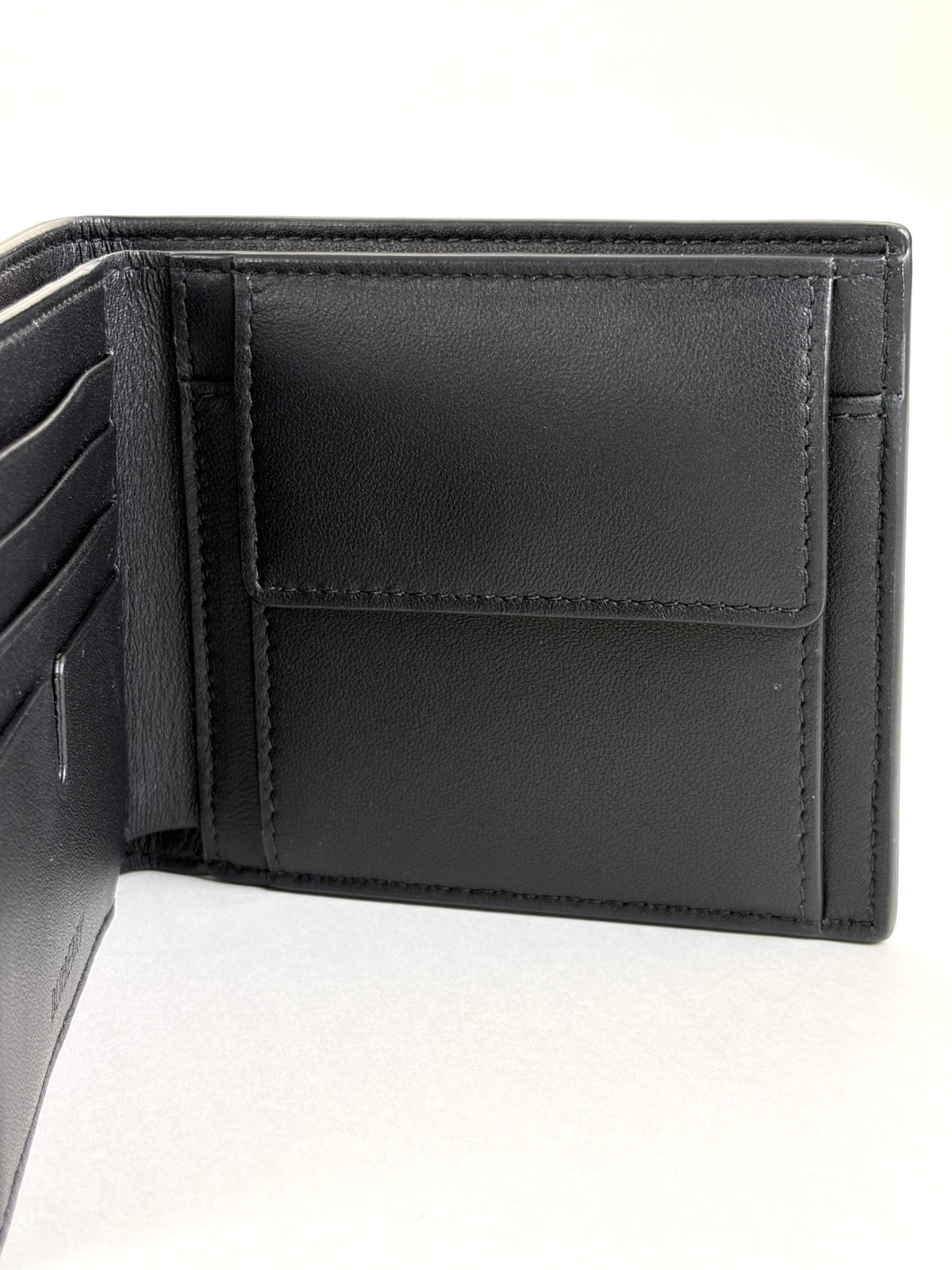 Burberry embossed check slim bifold wallet