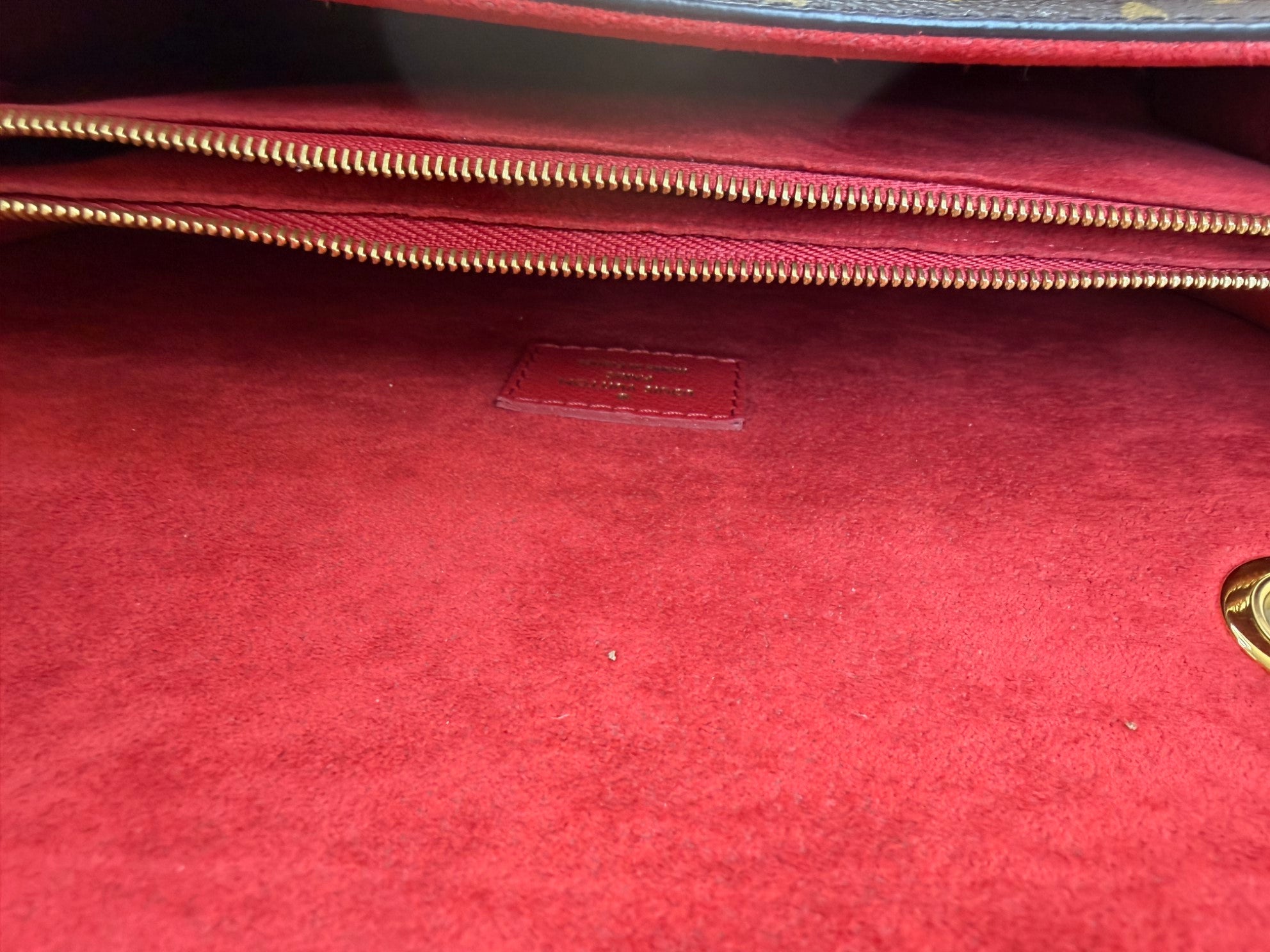 Louis Vuitton Monogram red flap Victoire Bag