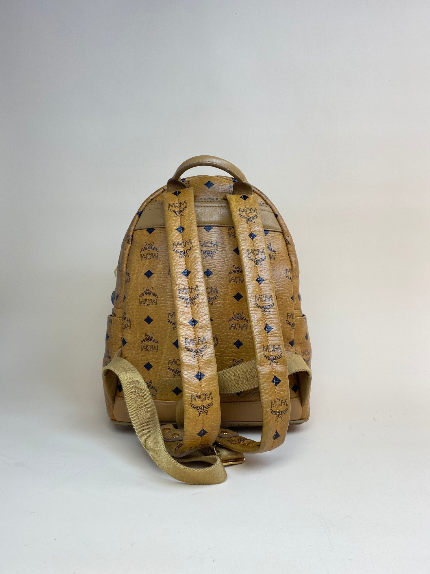 MCM cognac small backpack brown with studded-Backpack-MCM-The Closet Egypt
