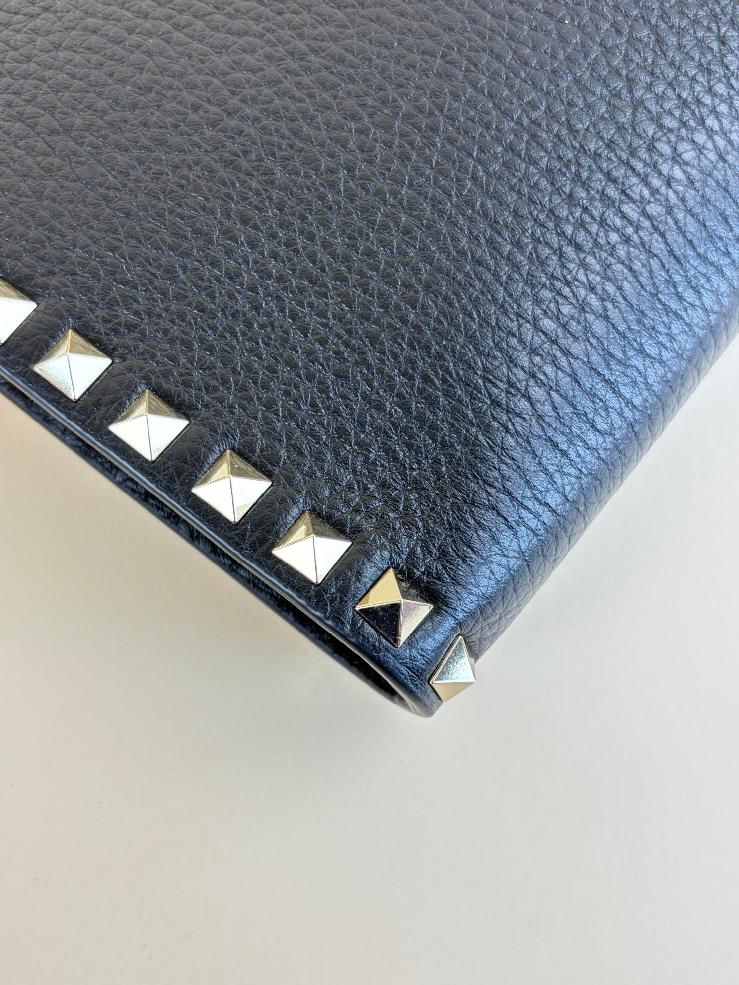 Valentino Black pebbled calfskin rockstud medium zip pouch