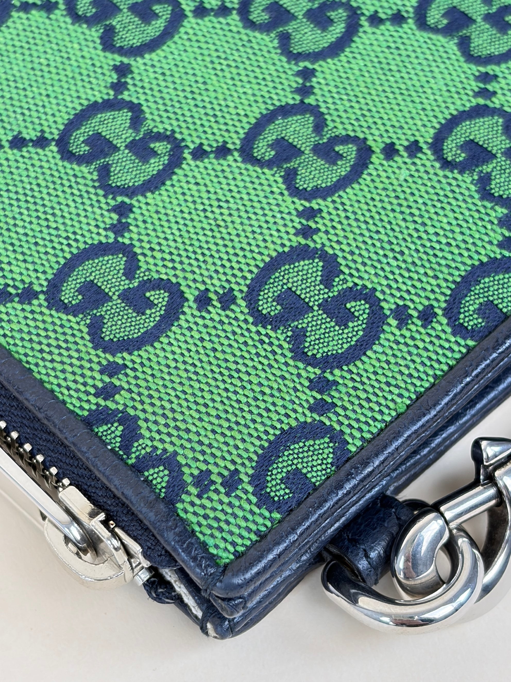 Gucci blue gg monogram multi color retro interlocking g wristlet pouch