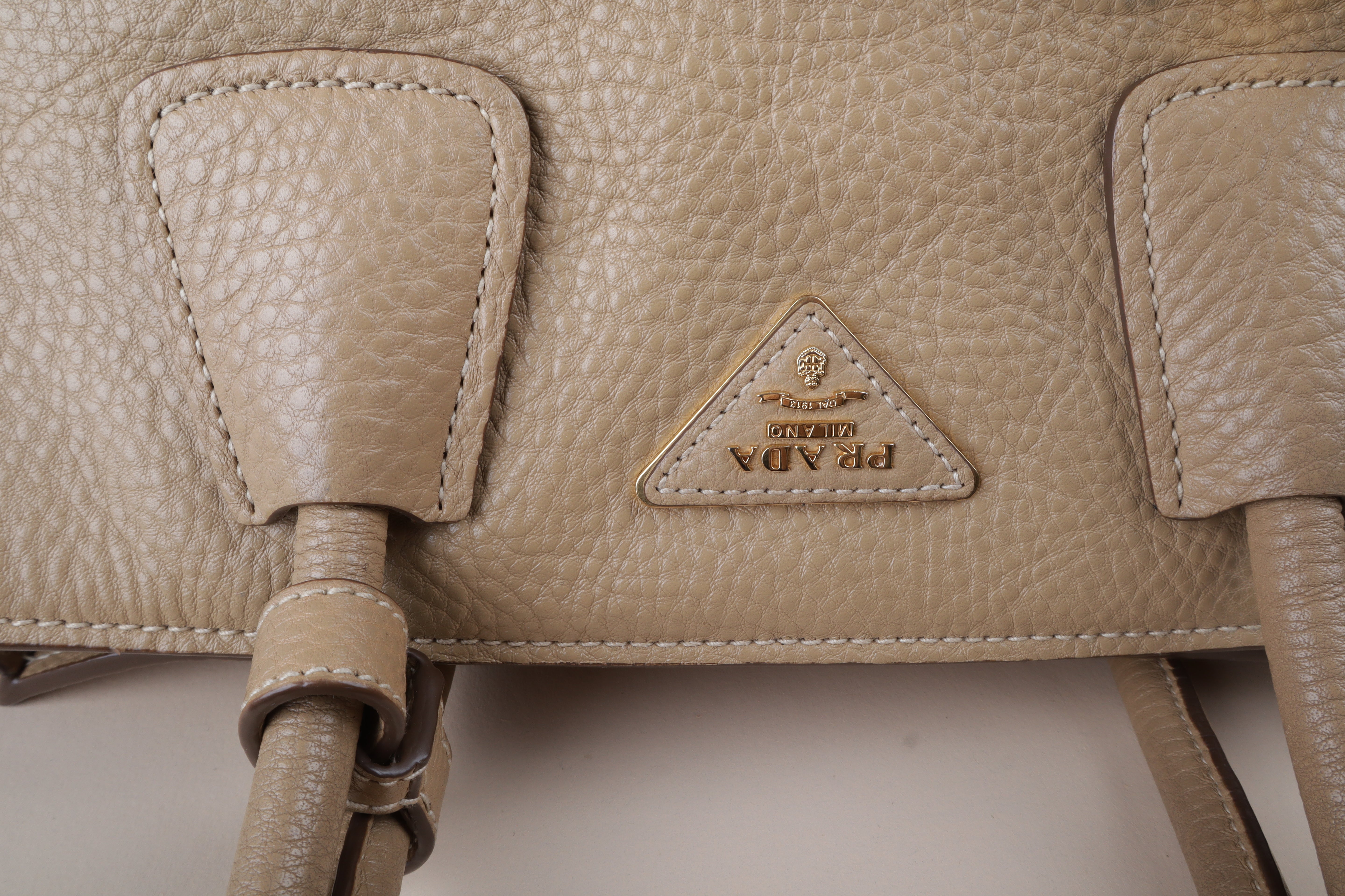 Prada beige front pocket wing convertible
