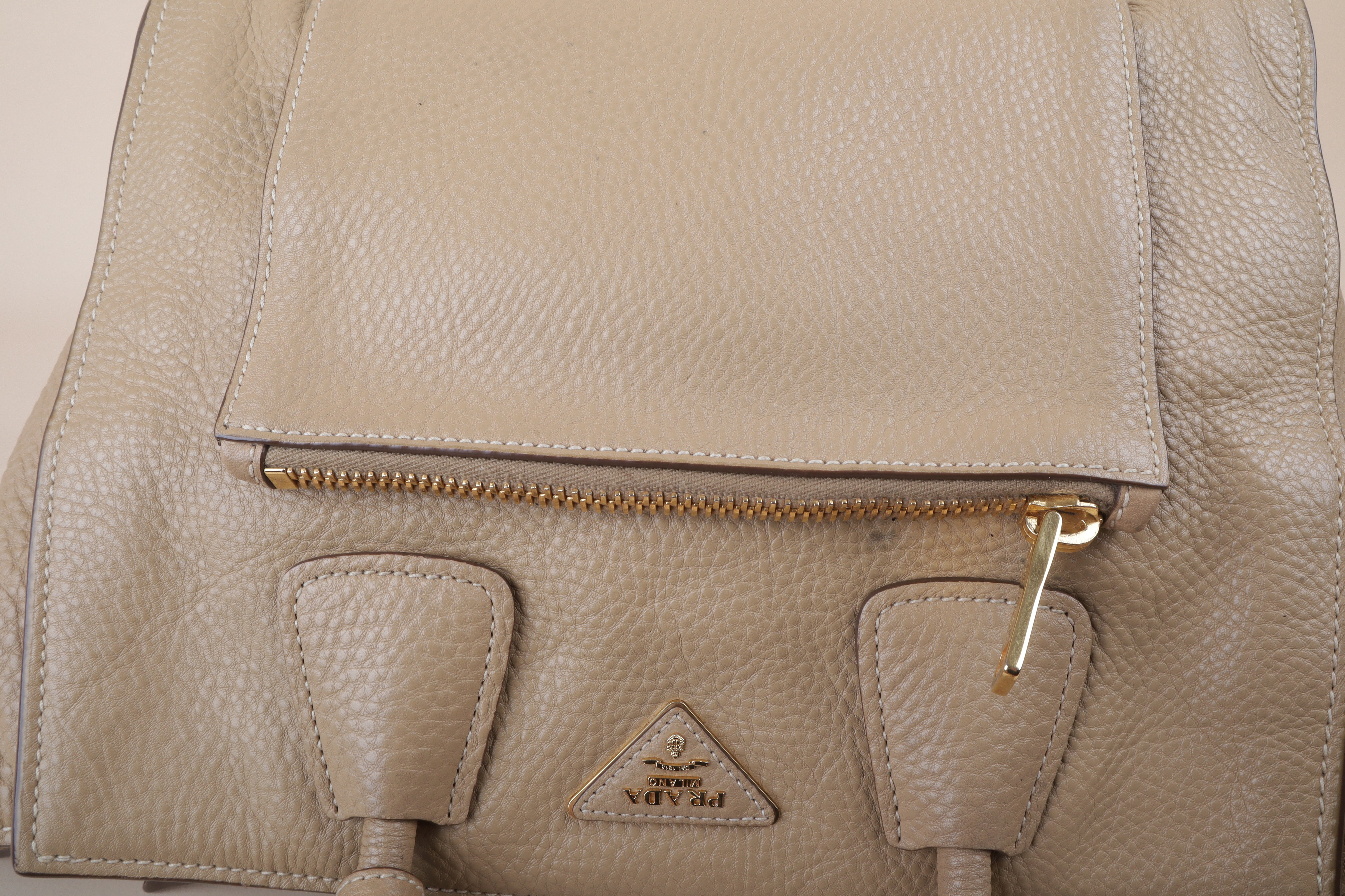 Prada beige front pocket wing convertible