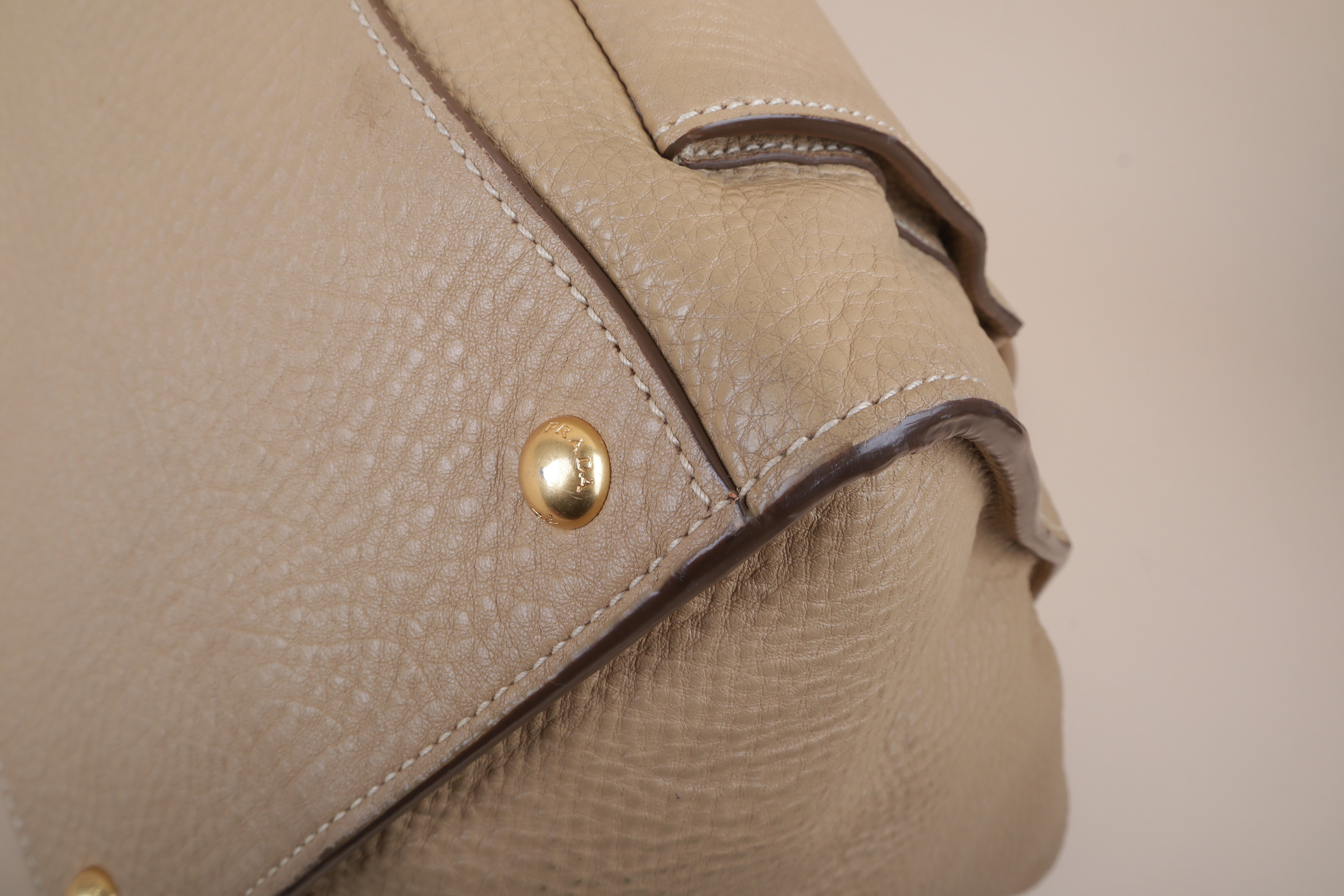 Prada beige front pocket wing convertible
