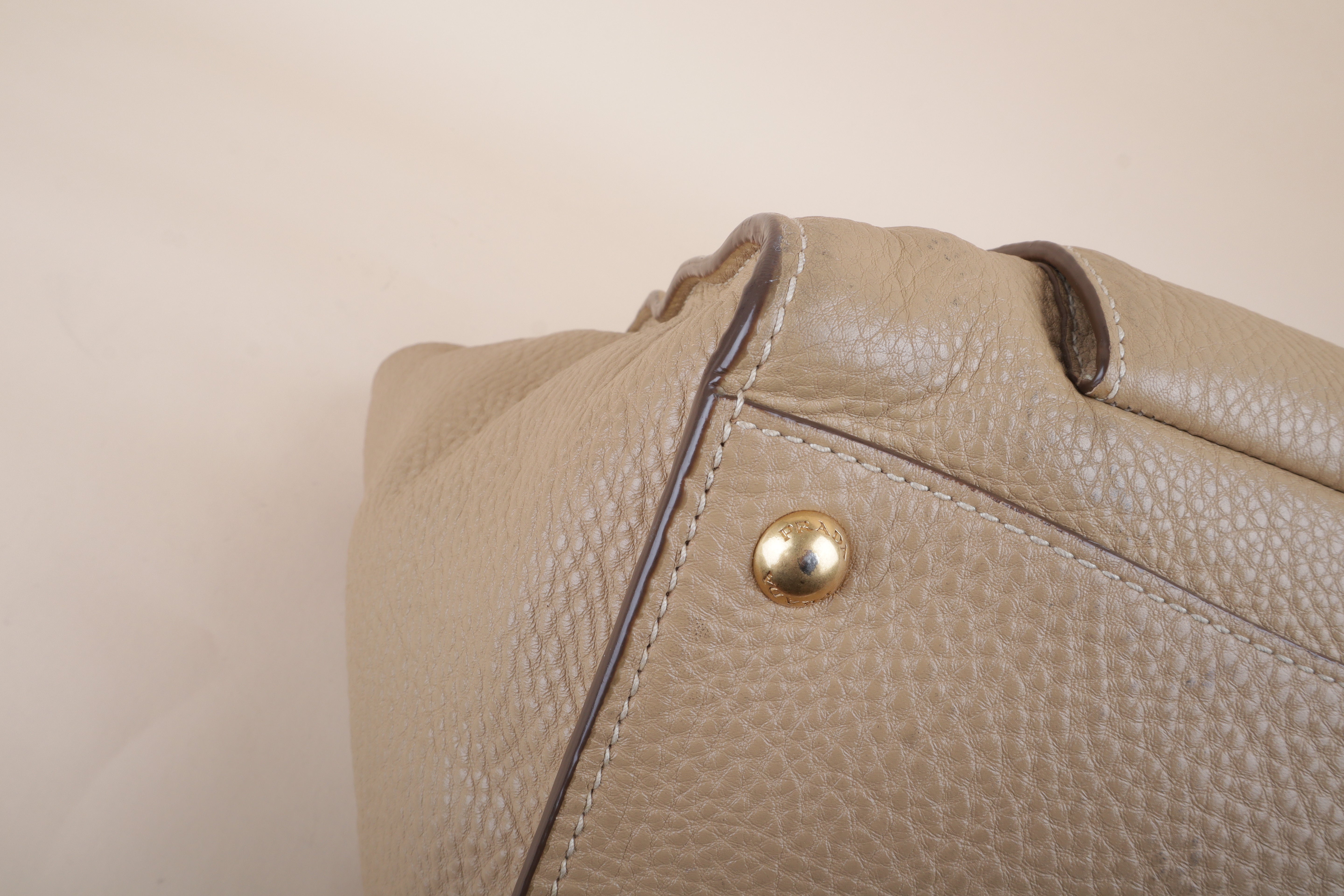 Prada beige front pocket wing convertible