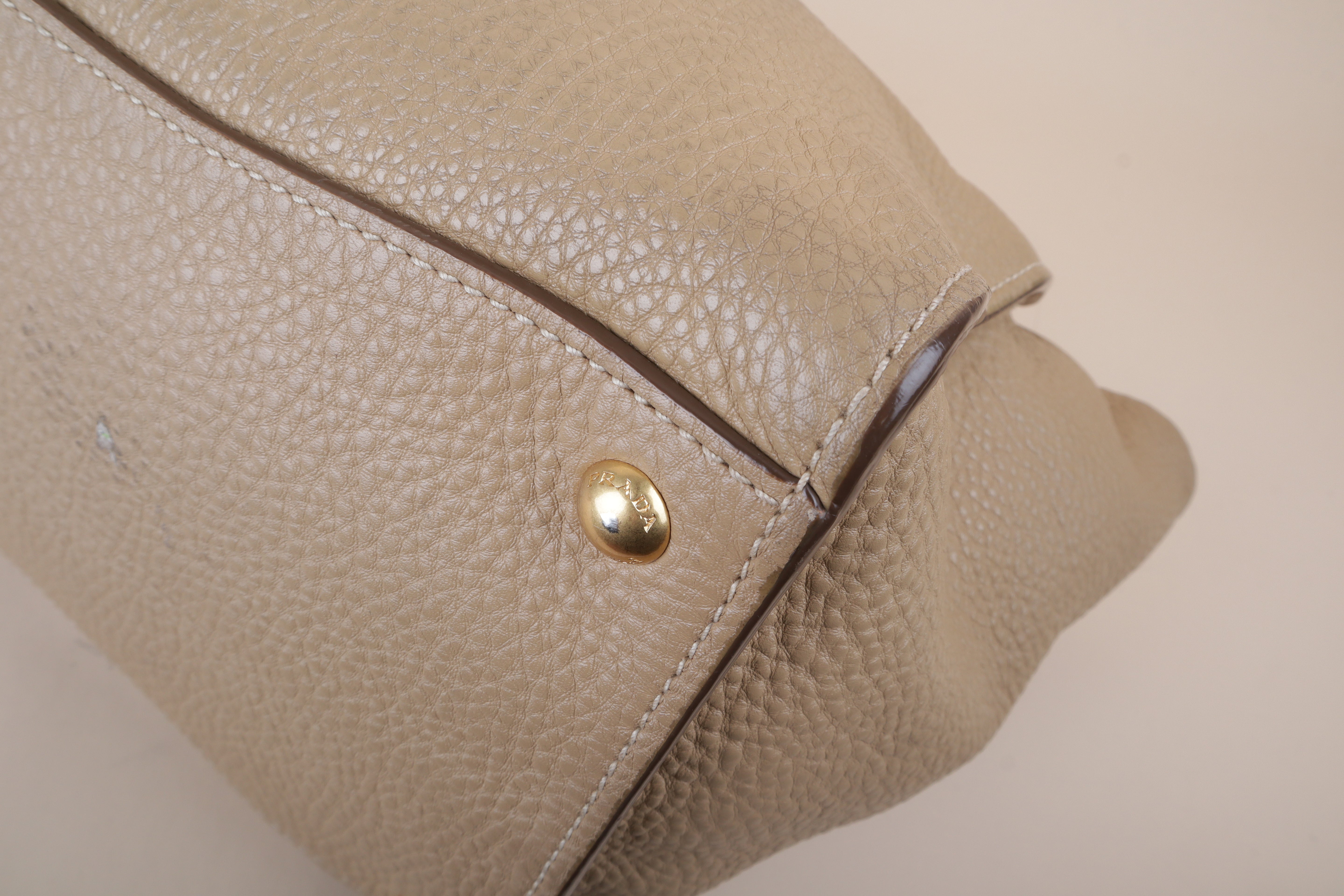 Prada beige front pocket wing convertible