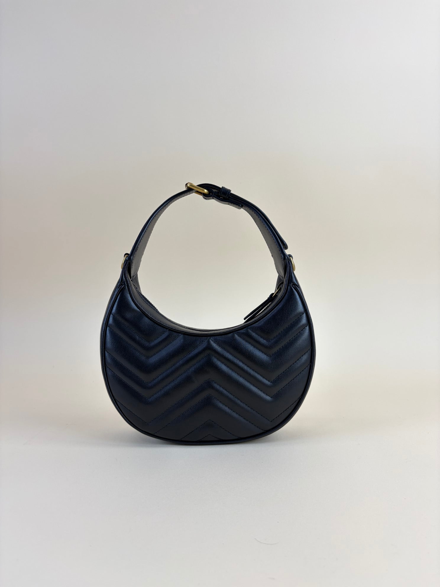 Gucci calfskin matelassé Black chevron small GG Marmont half-moon hob bag