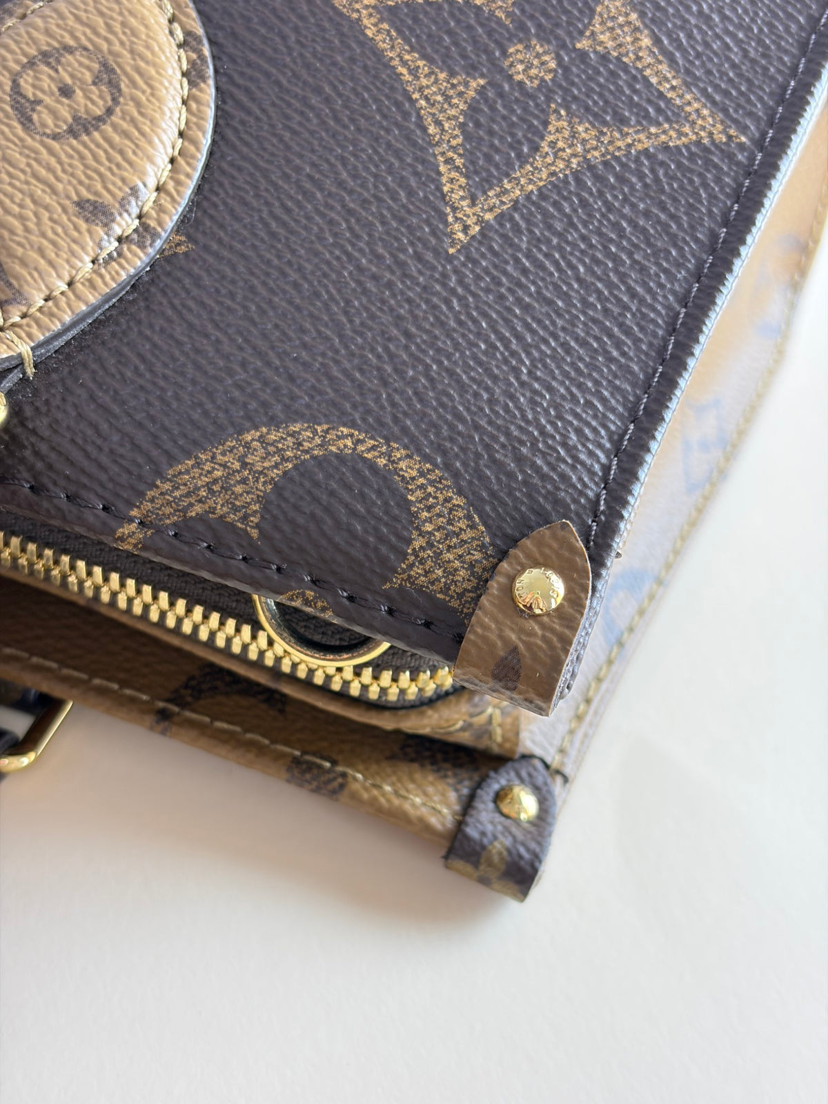 Louis Vuitton monogram reverse canvas on the go east-west tote bag