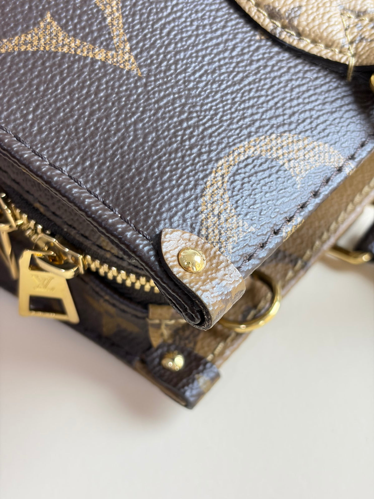 Louis Vuitton monogram reverse canvas on the go east-west tote bag