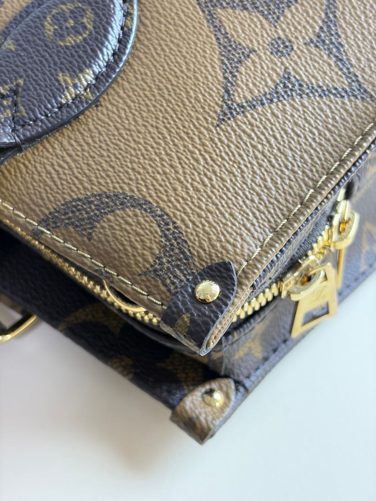 Louis Vuitton monogram reverse canvas on the go east-west tote bag