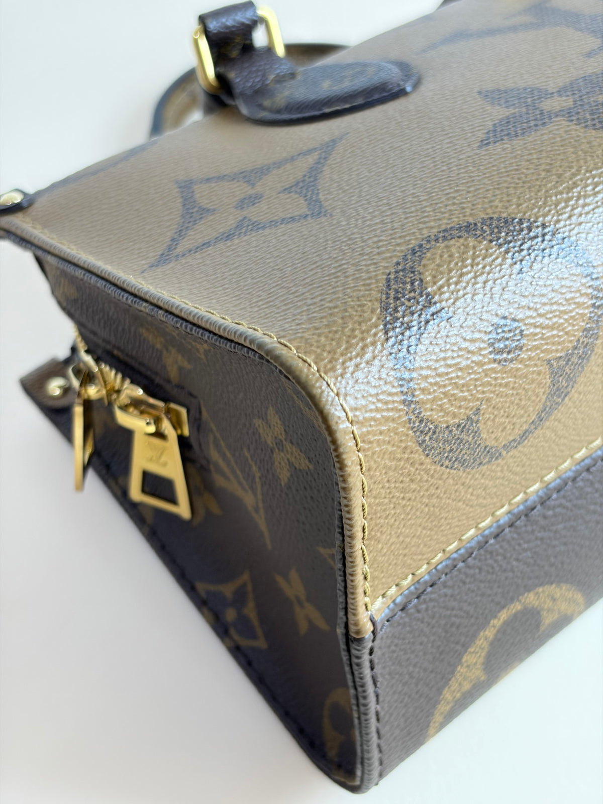 Louis Vuitton monogram reverse canvas on the go east-west tote bag