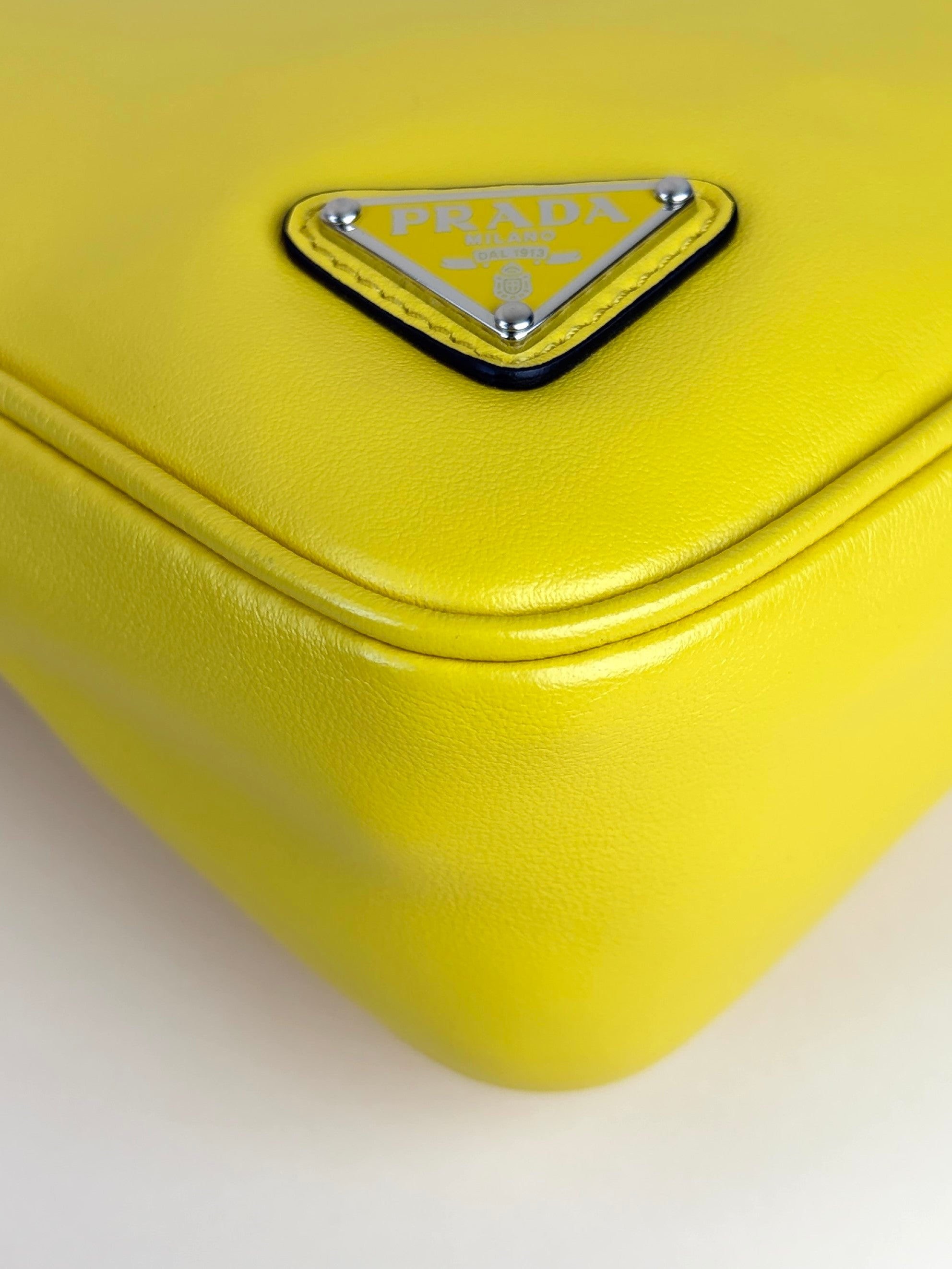 Prada sole grace lux yellow triangle wristlet pouch