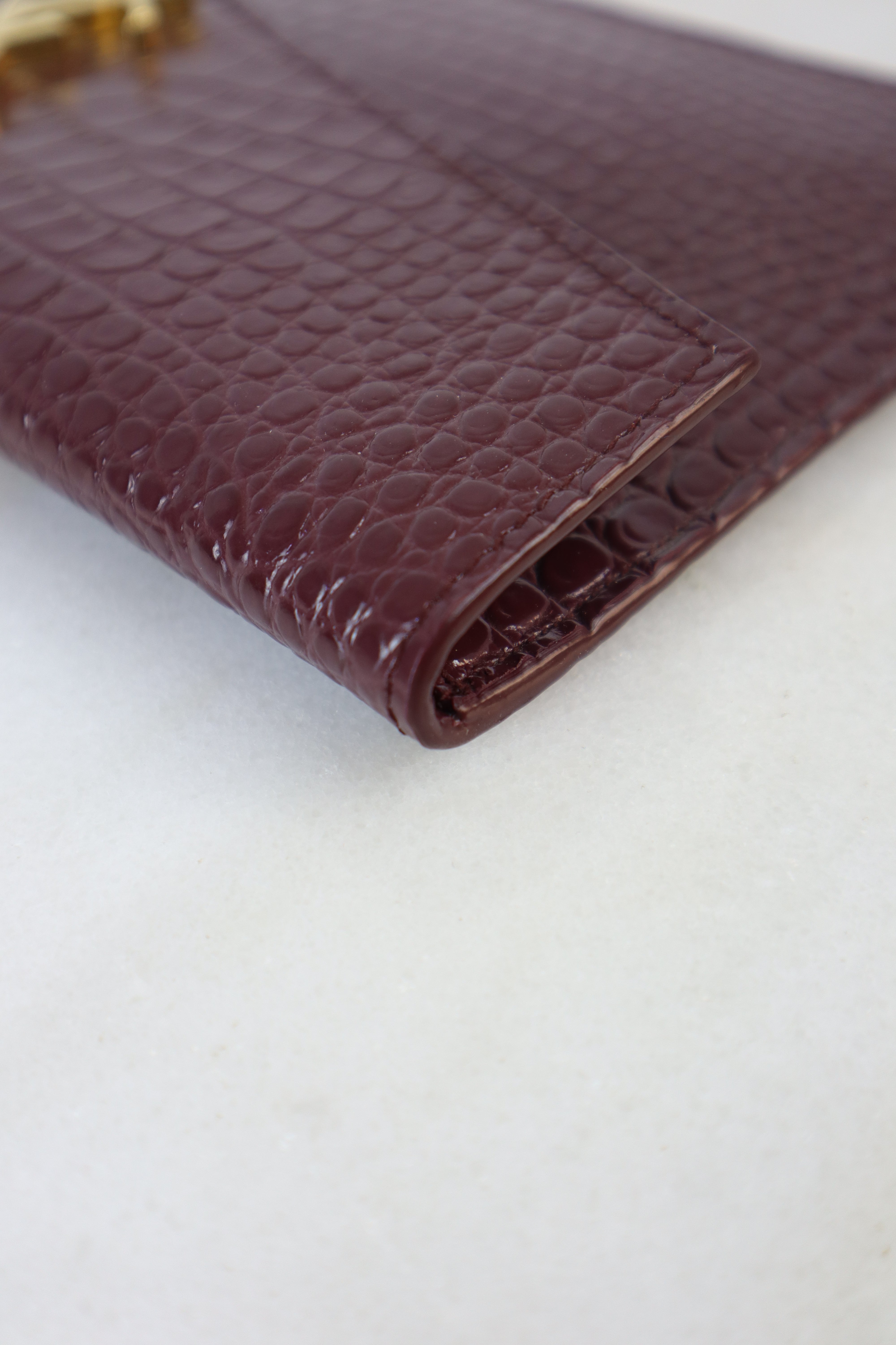 YSL Burgundy Croco Uptown Clutch