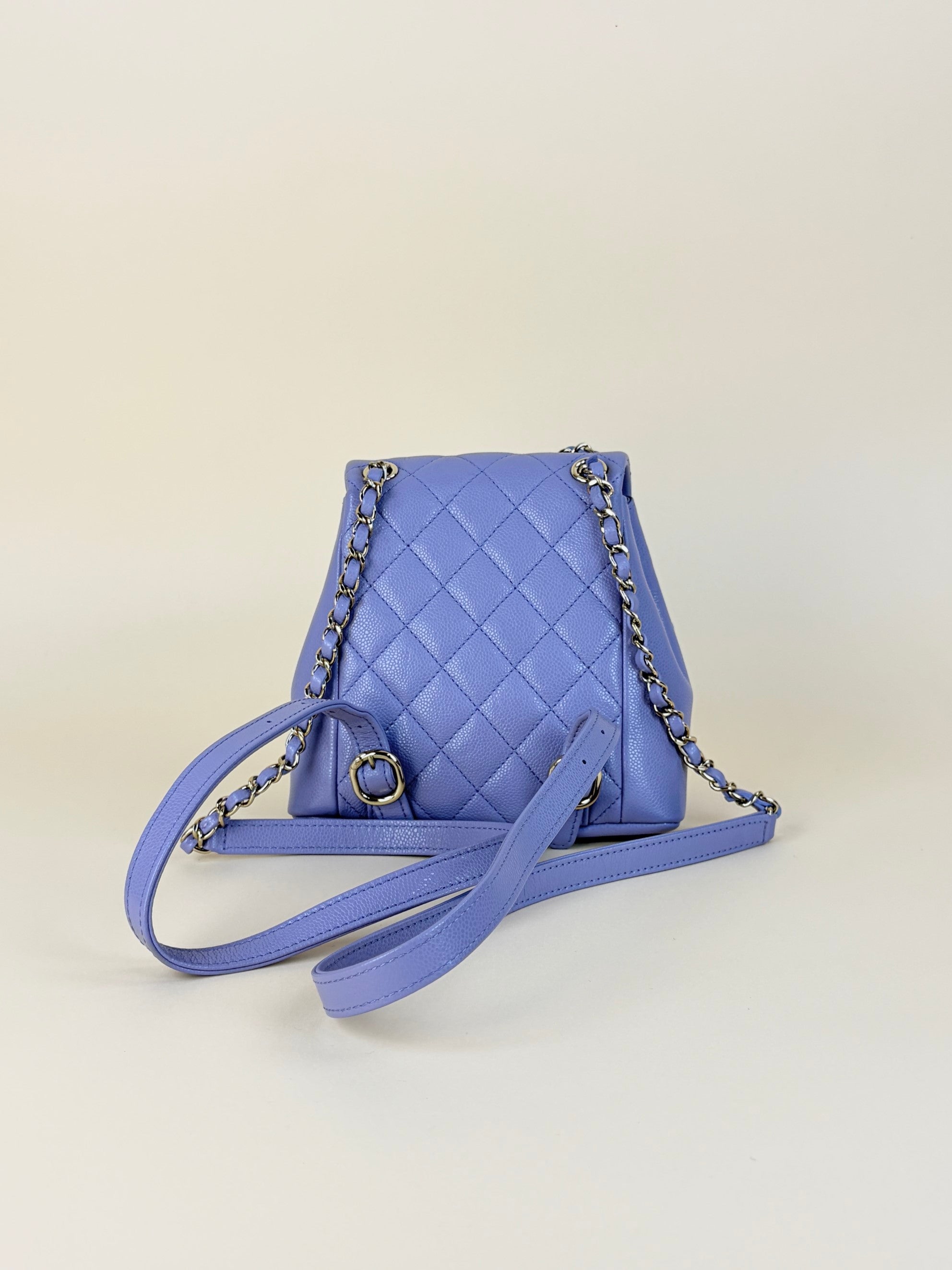 Chanel shiny caviar quilted small duma pockets drawstring backpack