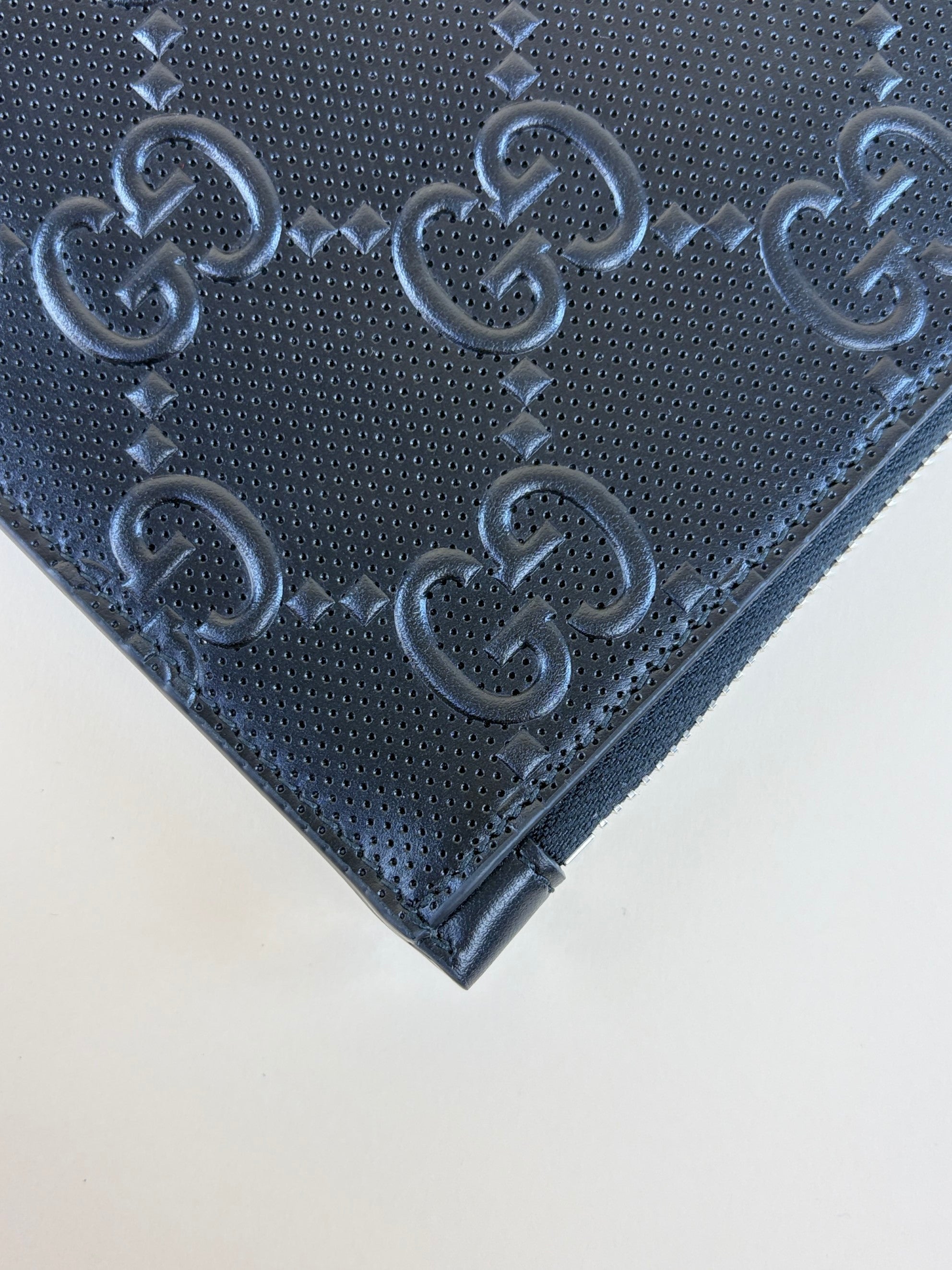 Gucci Black GG Tennis Embossed Wristlet Pouch