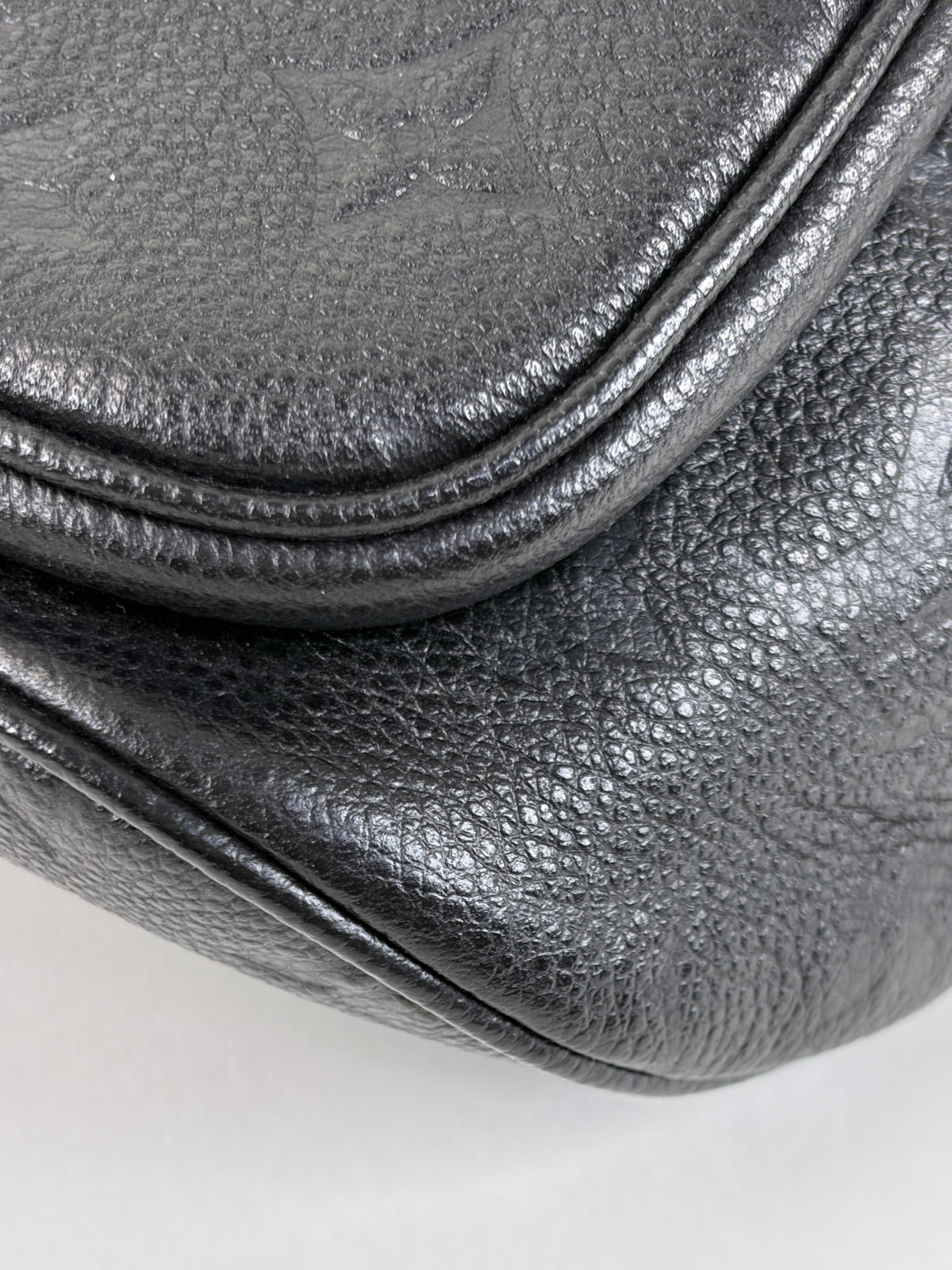 LOUIS VUITTON black monogram empreinte leather mini bumbag