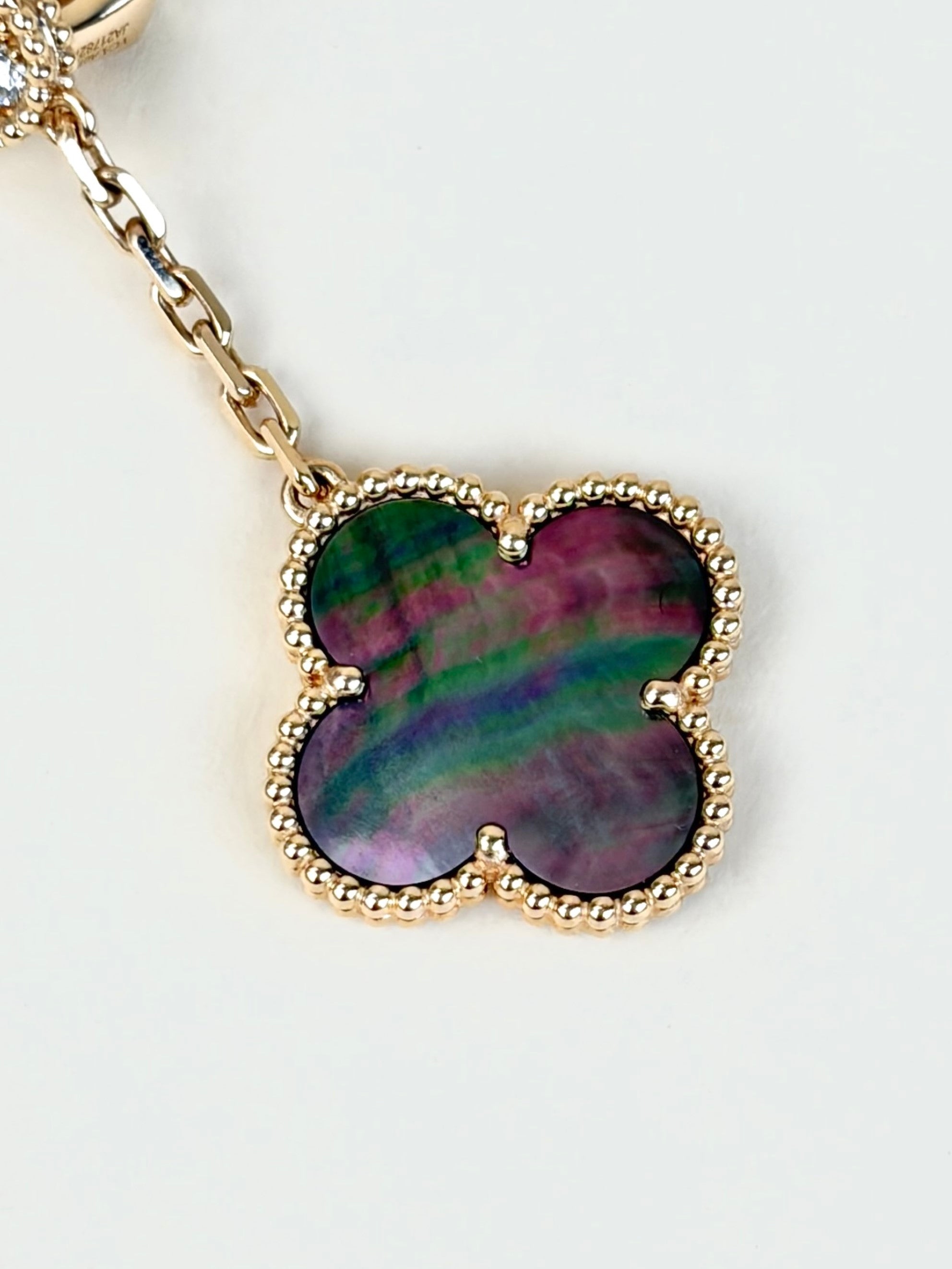 Van Cleef magic alhambra 2motifs 18 k rose gold and grey mother of pearl