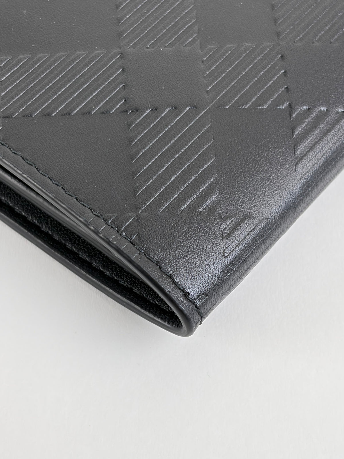 Burberry embossed check slim bifold wallet