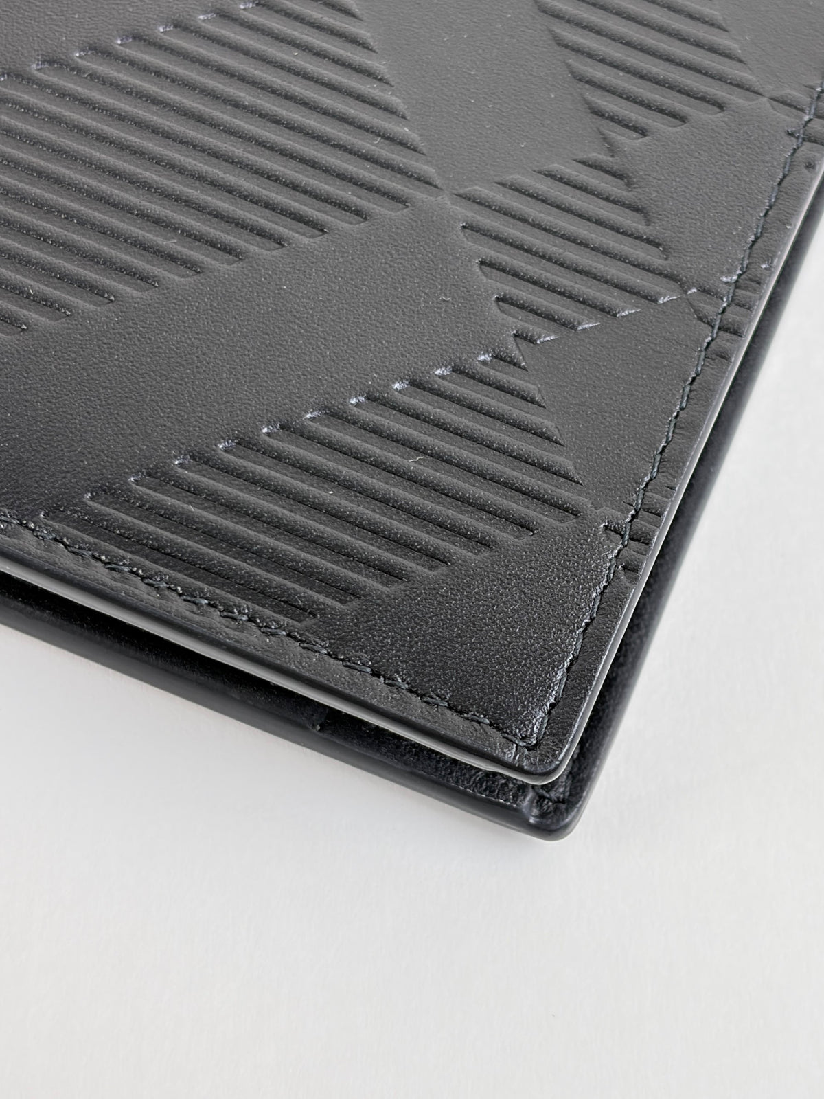 Burberry embossed check slim bifold wallet