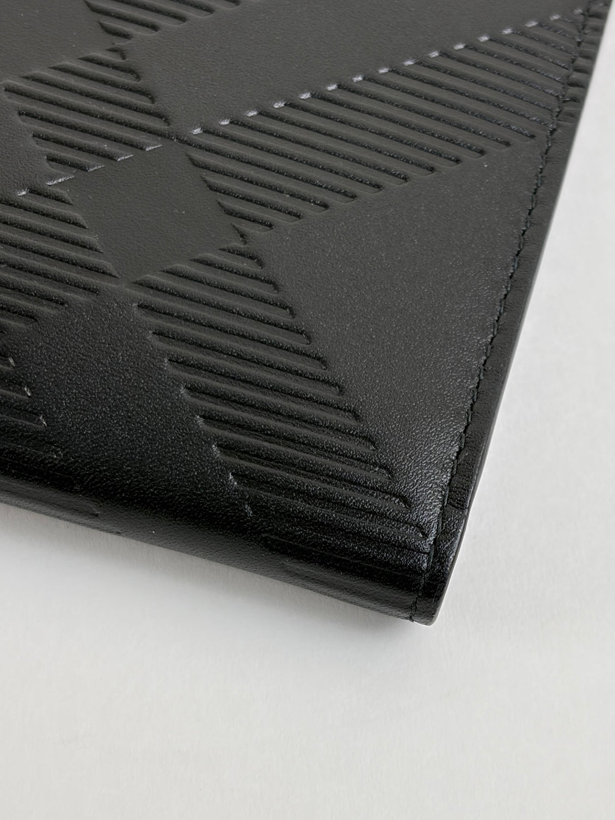 Burberry embossed check slim bifold wallet