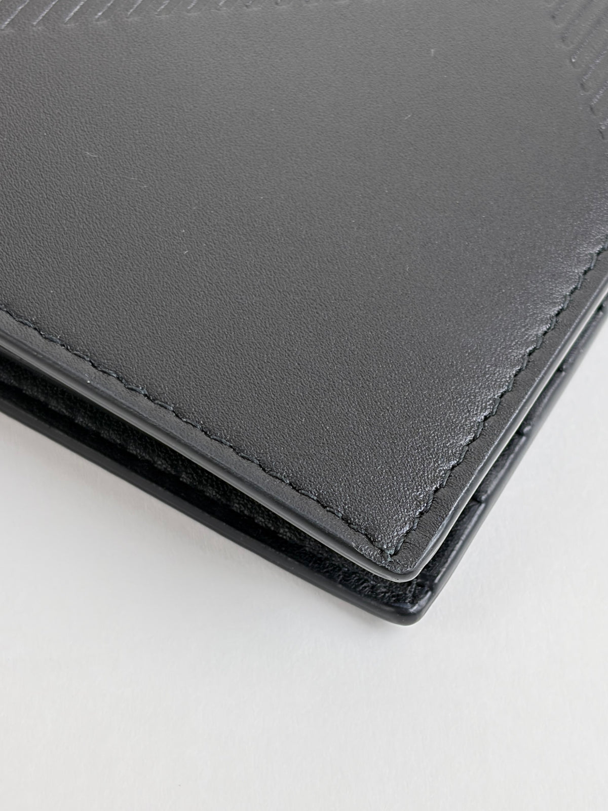Burberry embossed check slim bifold wallet