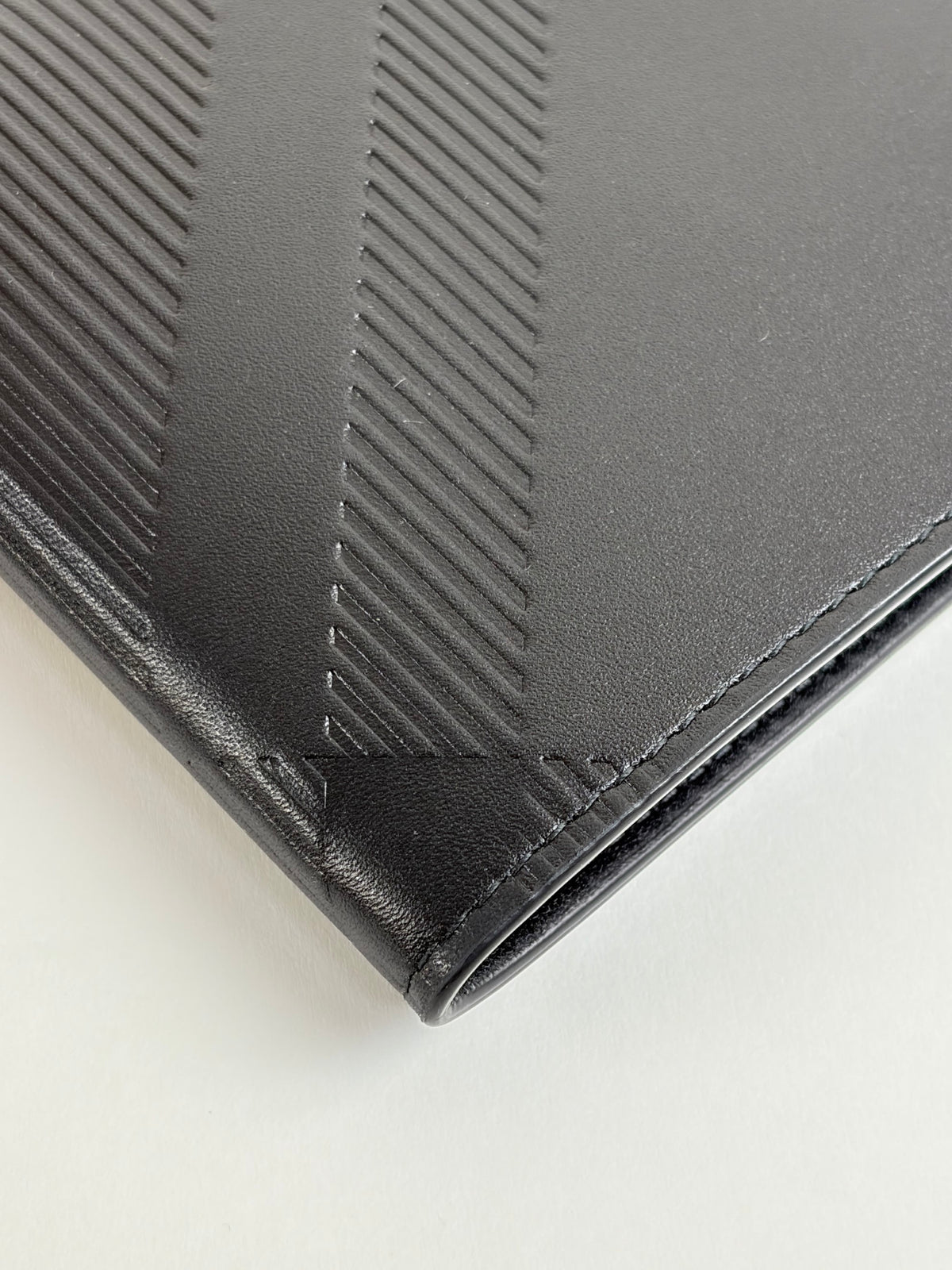 Burberry embossed check slim bifold wallet