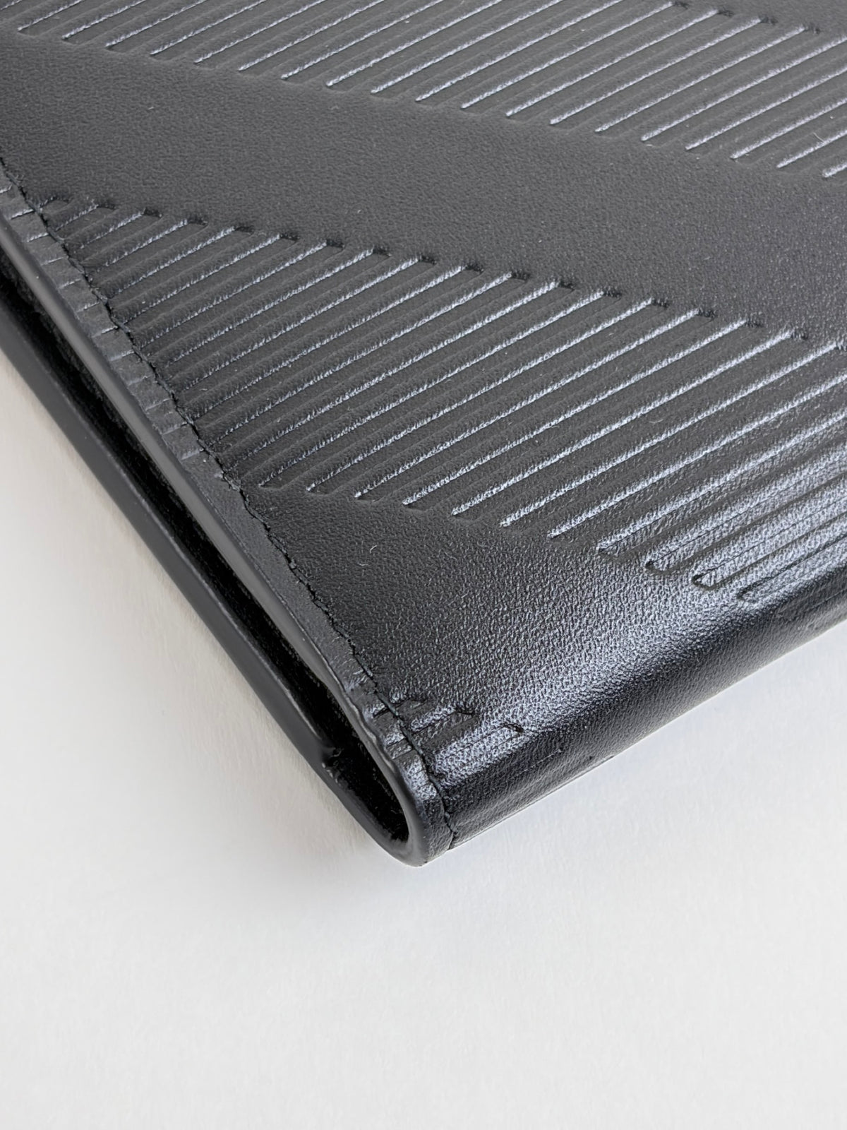 Burberry embossed check slim bifold wallet