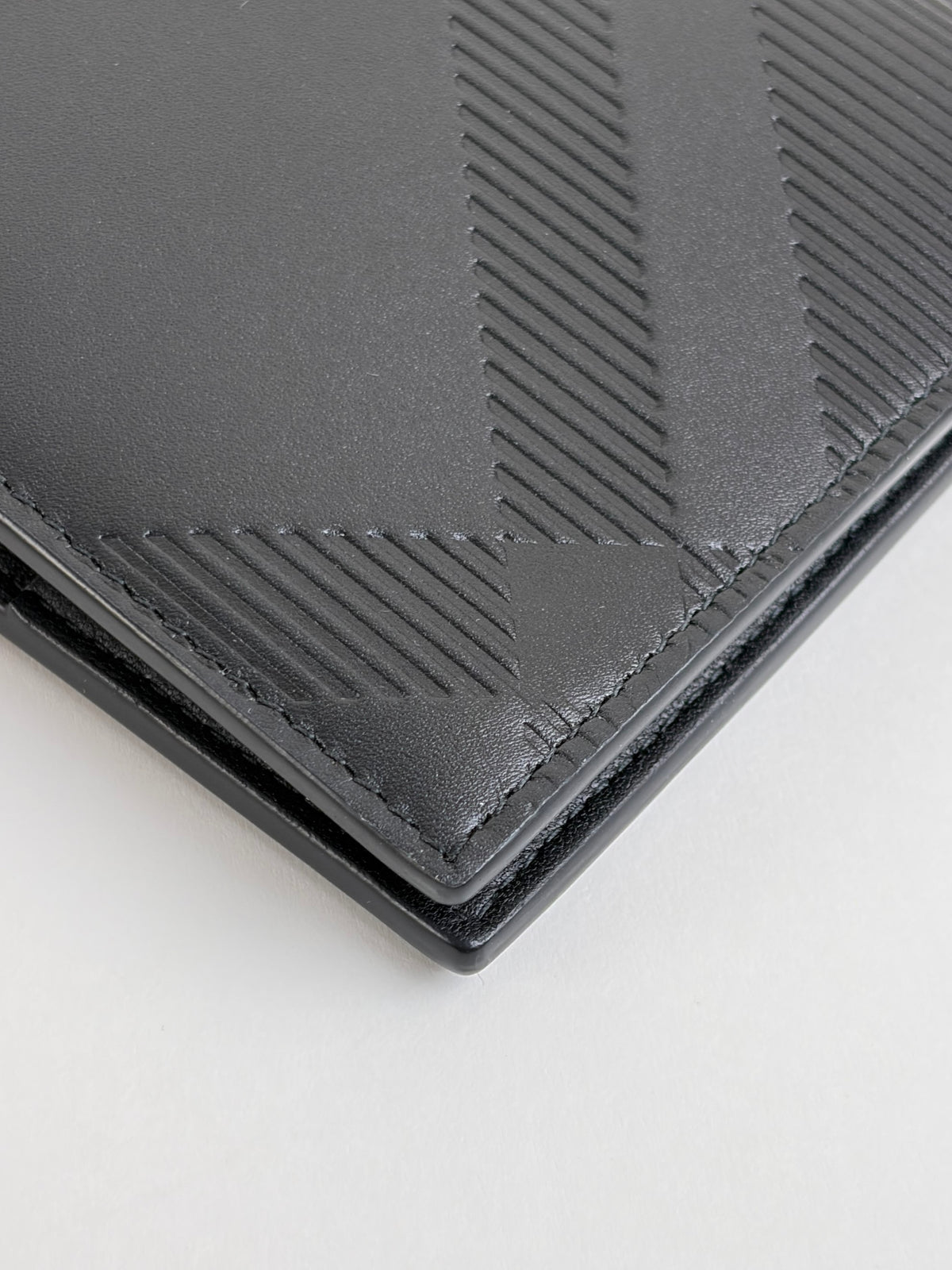 Burberry embossed check slim bifold wallet