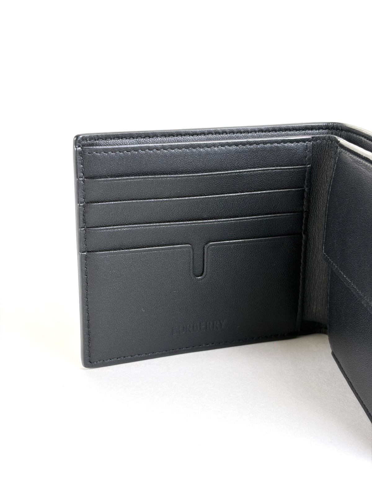 Burberry embossed check slim bifold wallet