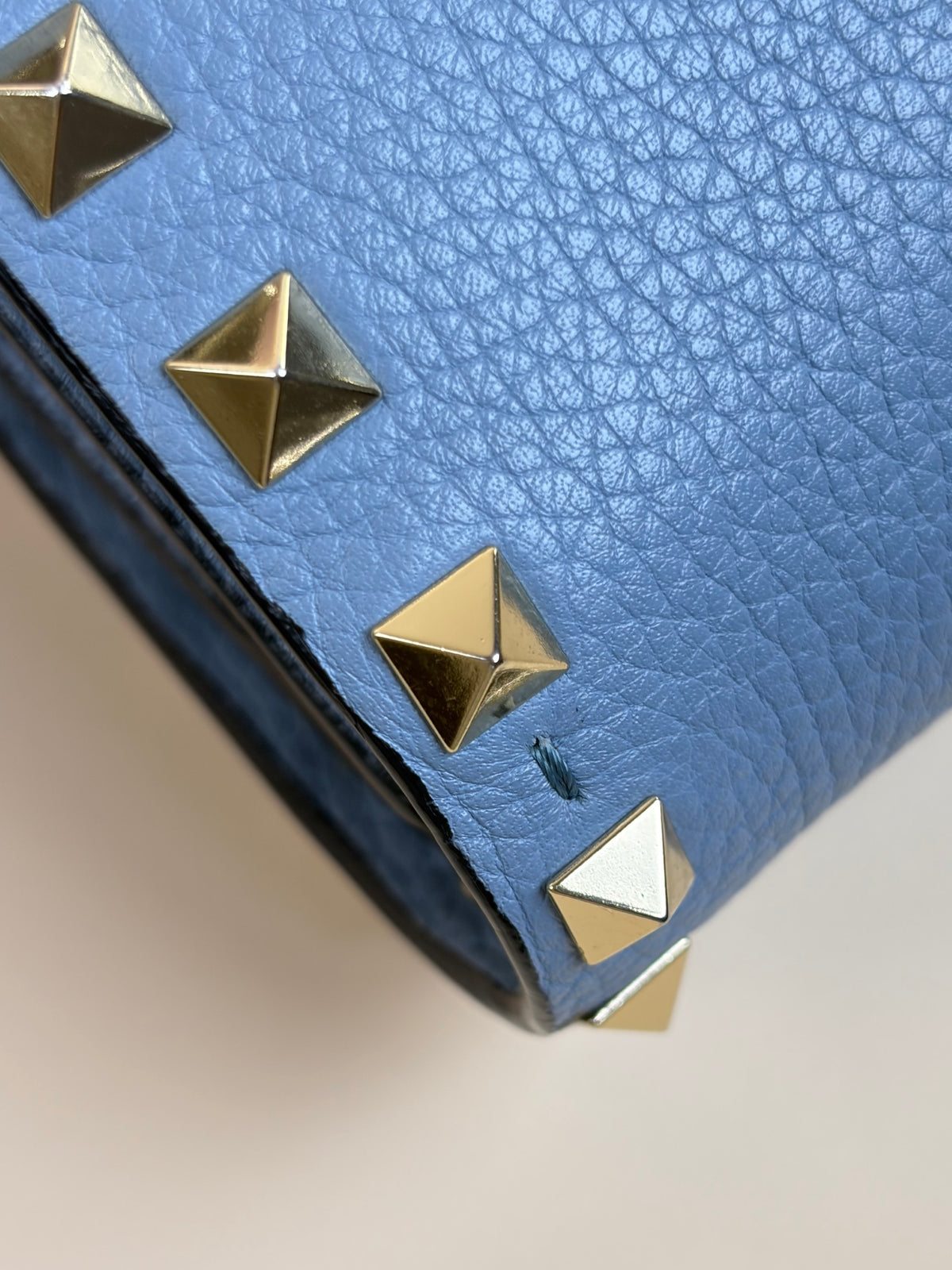 Valentino pebbled calfskin rock stud wallet on chain light blue