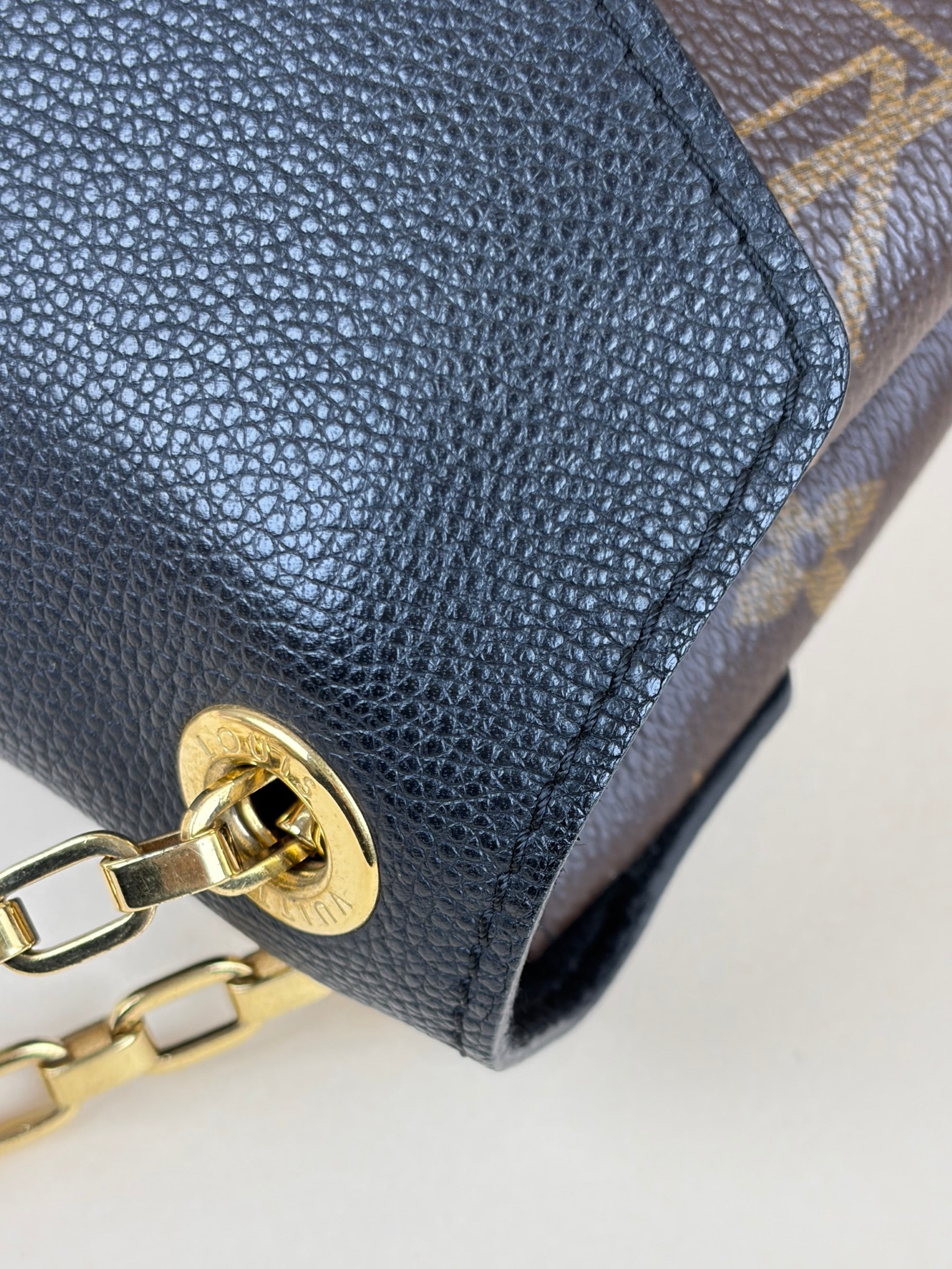 Louis Vuitton canvas and black calfskin Pallas chain