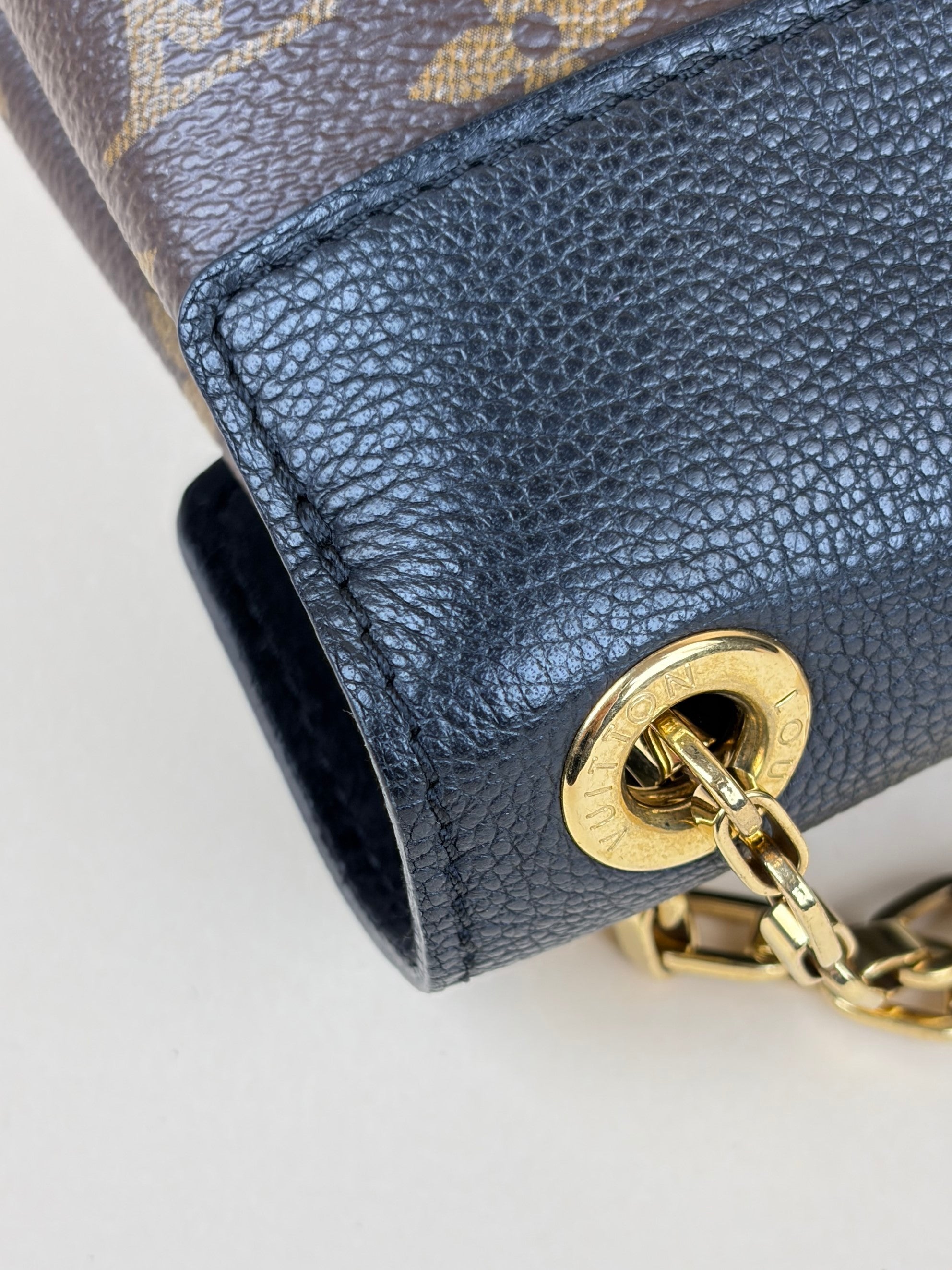 Louis Vuitton canvas and black calfskin Pallas chain