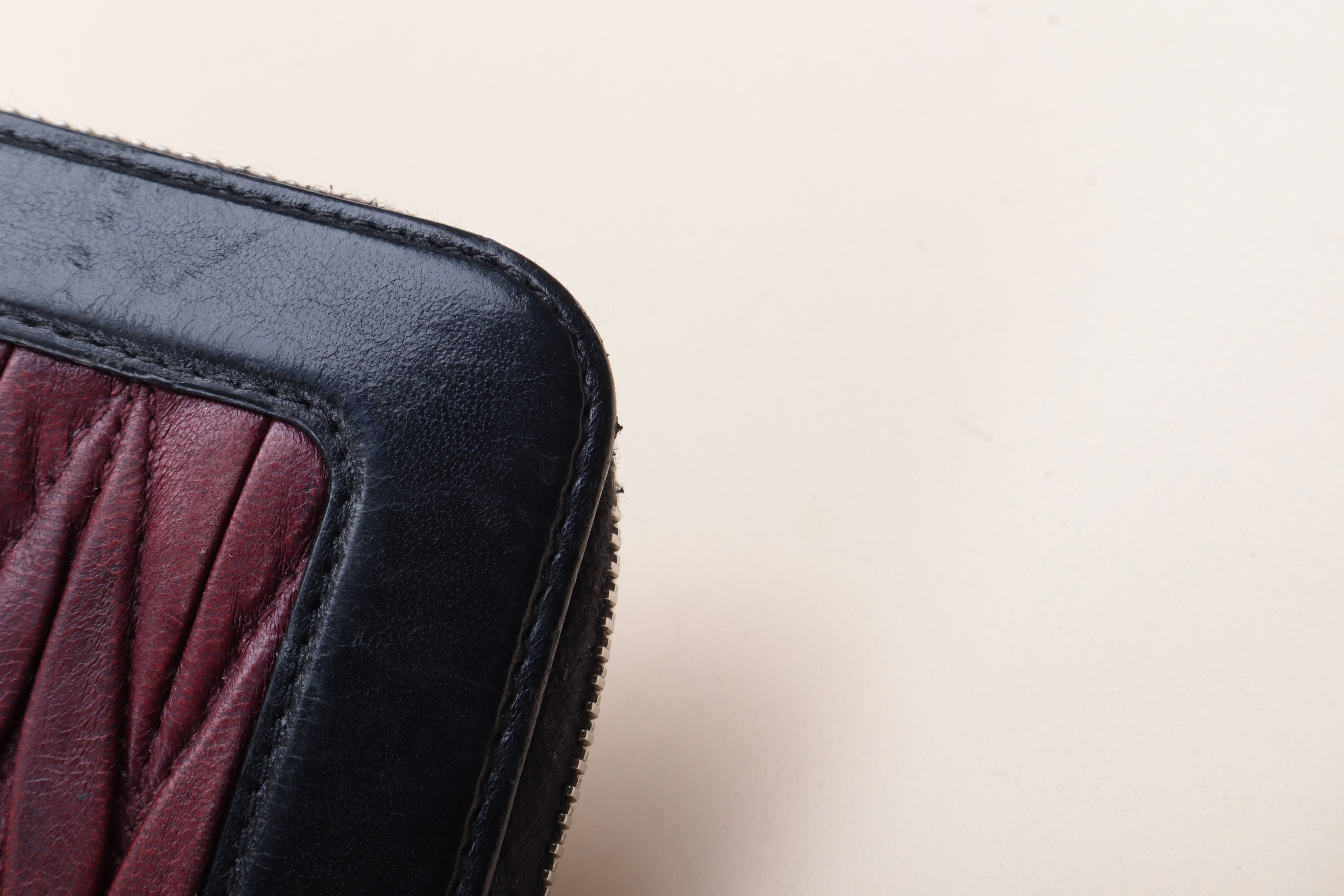 MIU MIU black and burgundy Matelassé Zip around