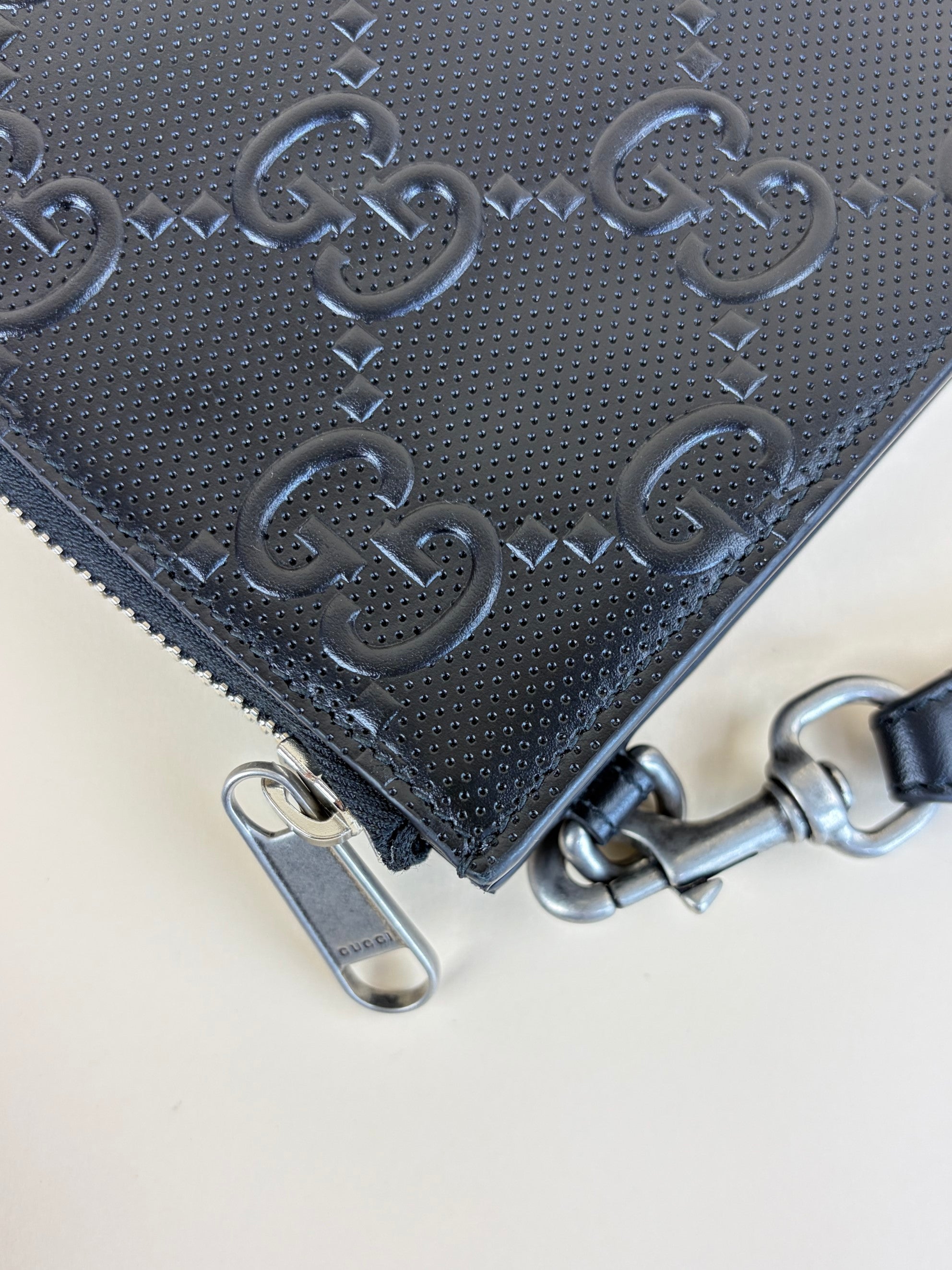 Gucci black calfskin gg tennis embossed wristlet pouch