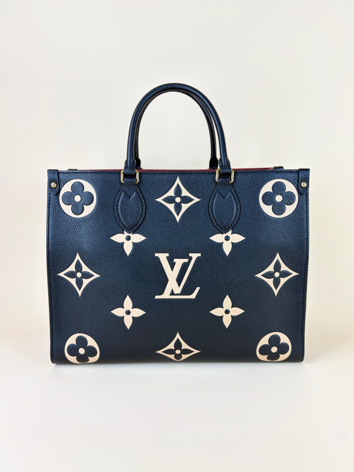Louis Vuitton bicolor Monogram giant empriente on the go mm bag