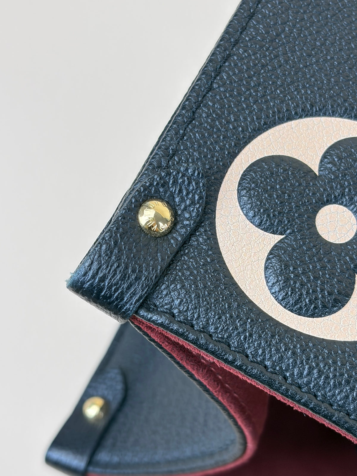 Louis Vuitton bicolor Monogram giant empriente on the go mm bag