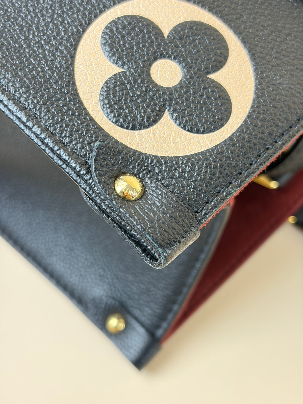 Louis Vuitton bicolor Monogram giant empriente on the go mm bag