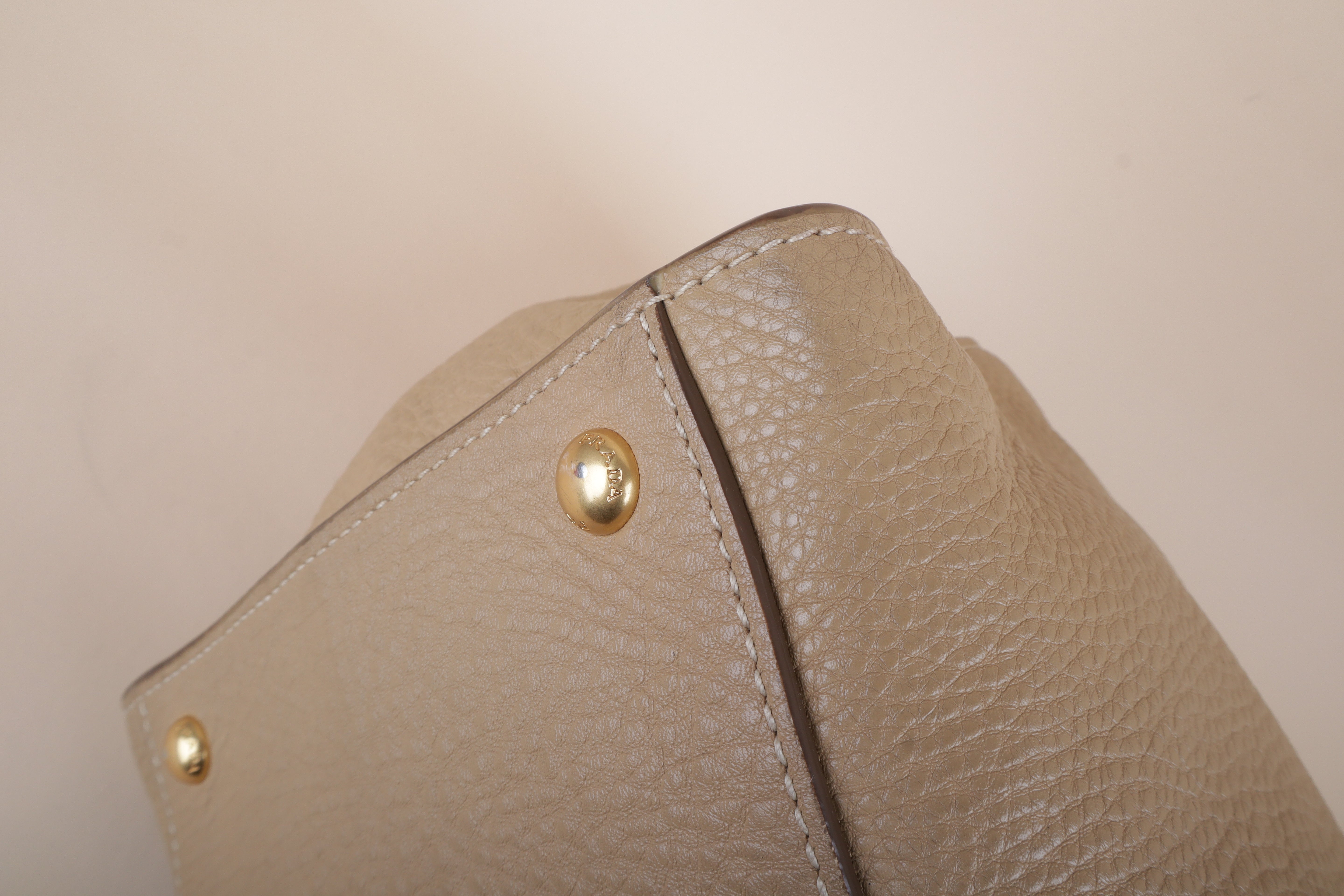 Prada beige front pocket wing convertible