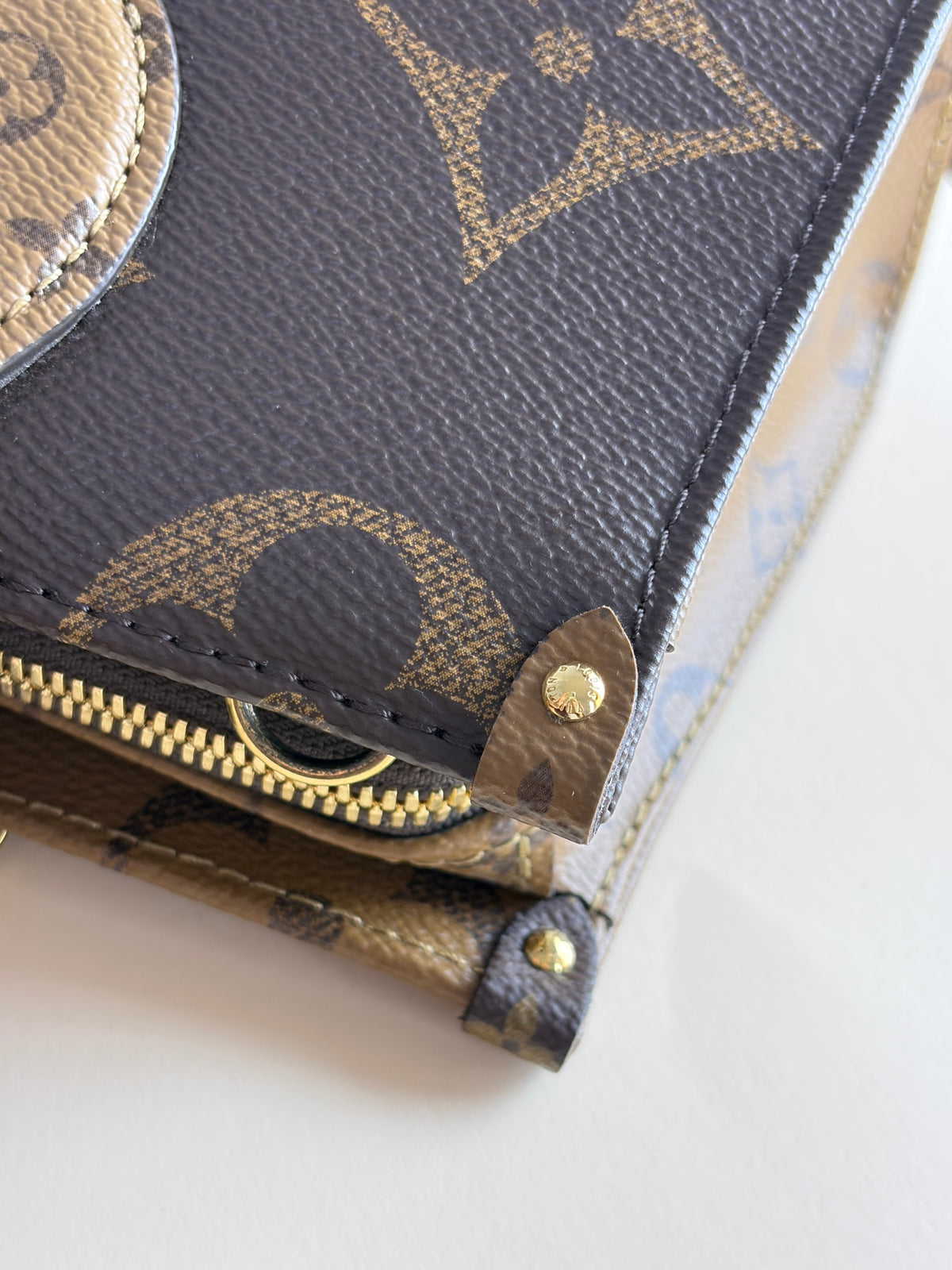 Louis Vuitton monogram reverse canvas on the go east-west tote bag