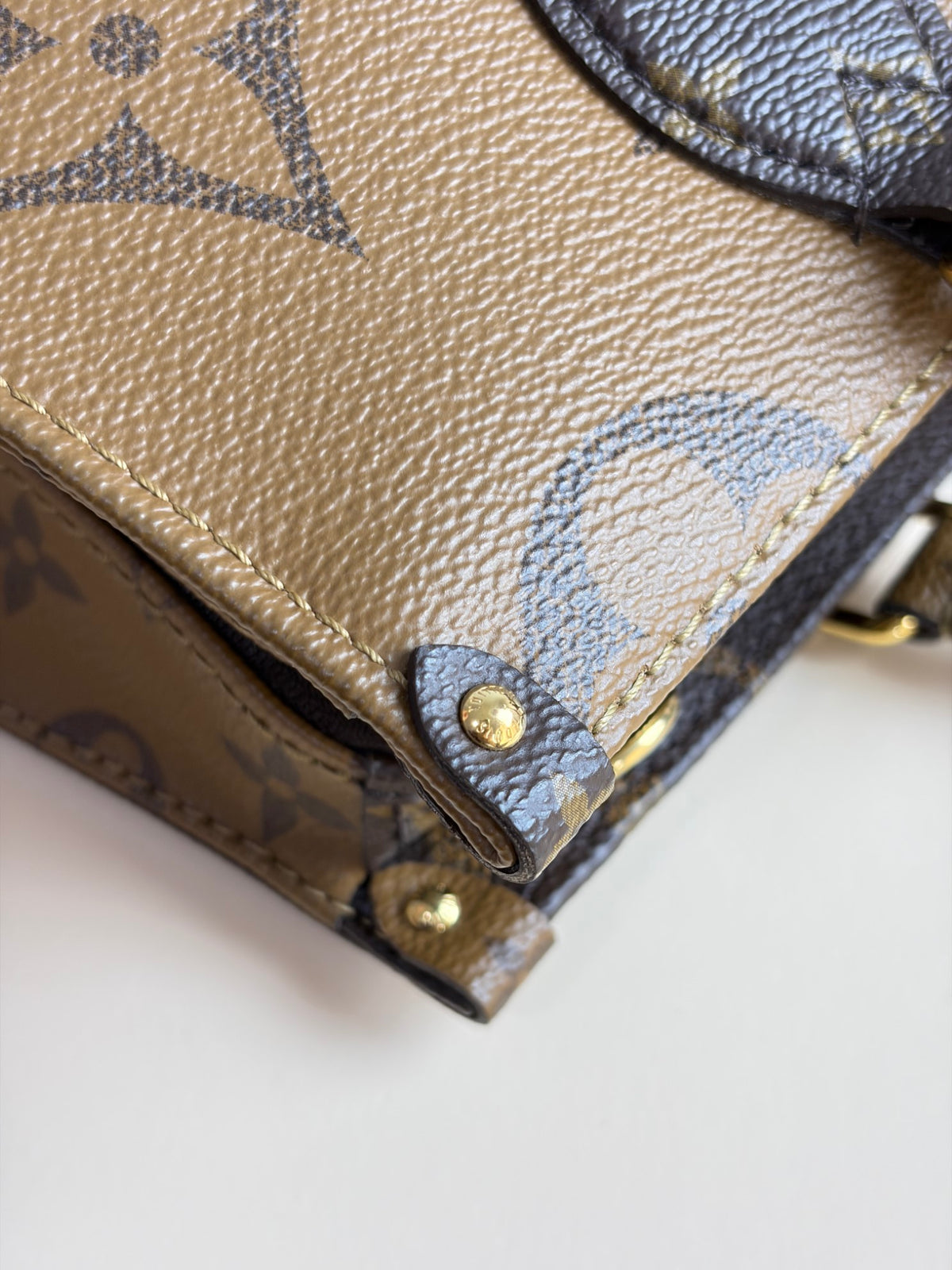 Louis Vuitton monogram reverse canvas on the go east-west tote bag