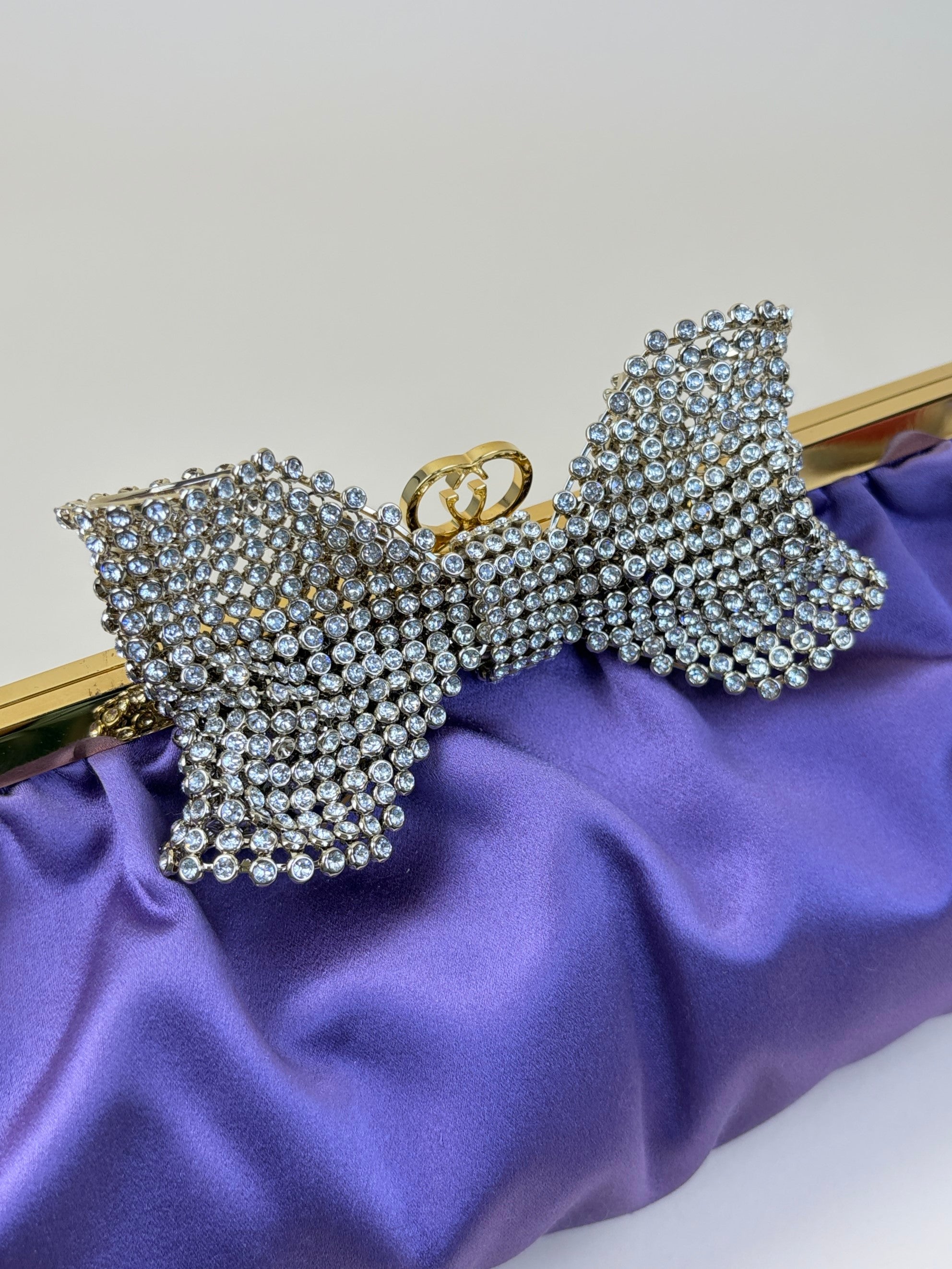 Gucci satin purple crystal embellished bow clutch