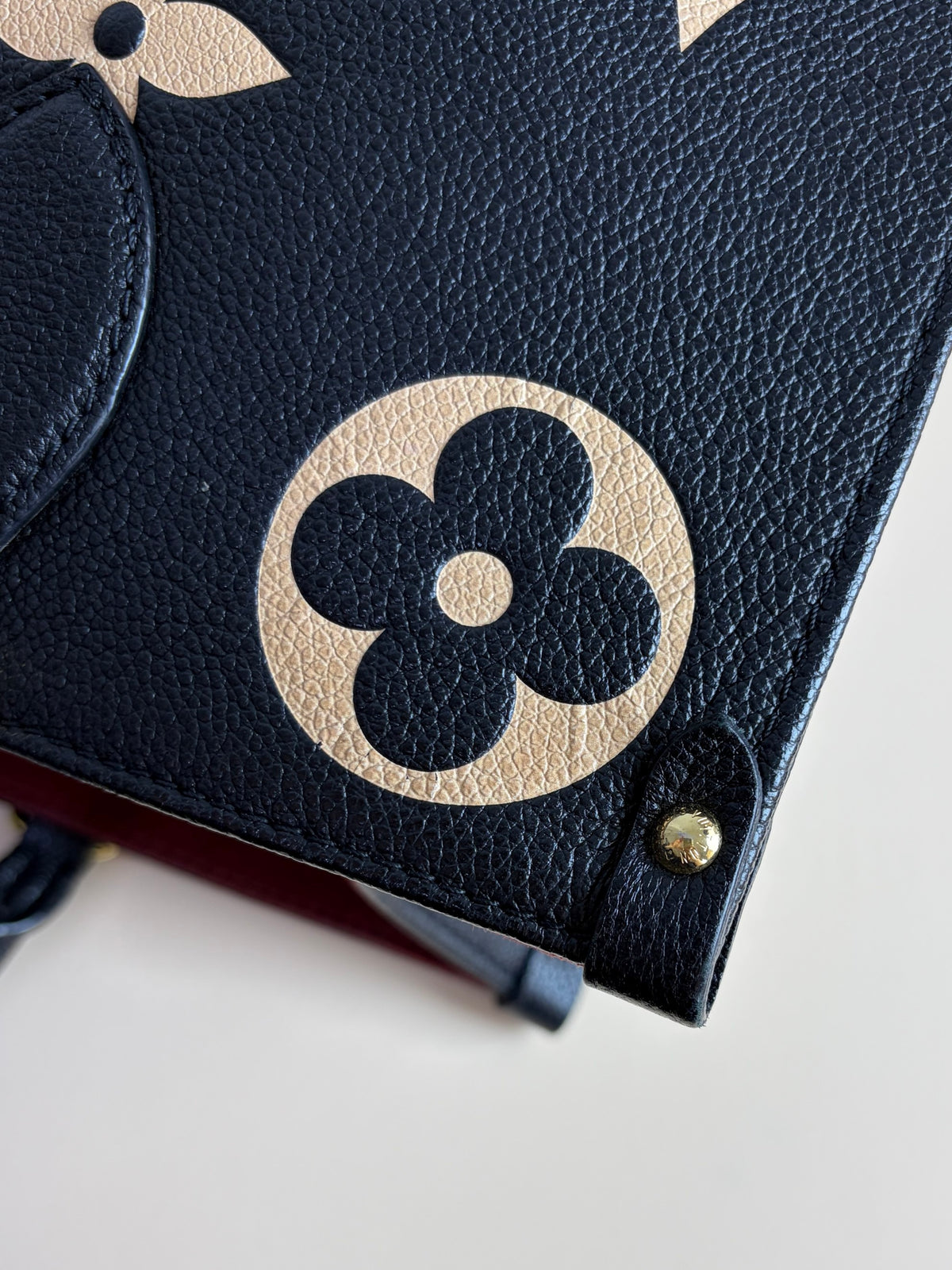 Louis Vuitton black/beige Monogram giant empriente on the go mm bag