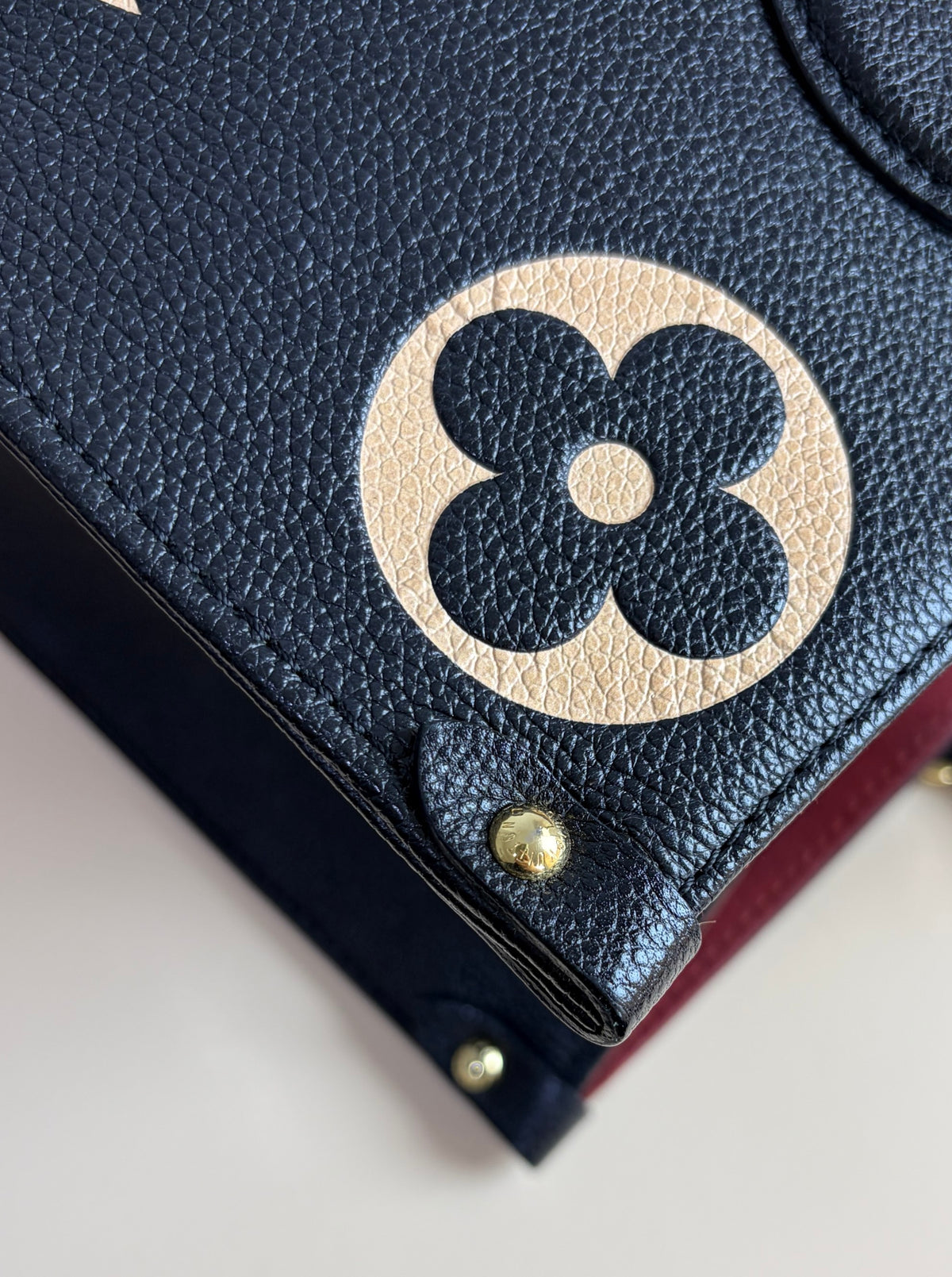 Louis Vuitton black/beige Monogram giant empriente on the go mm bag